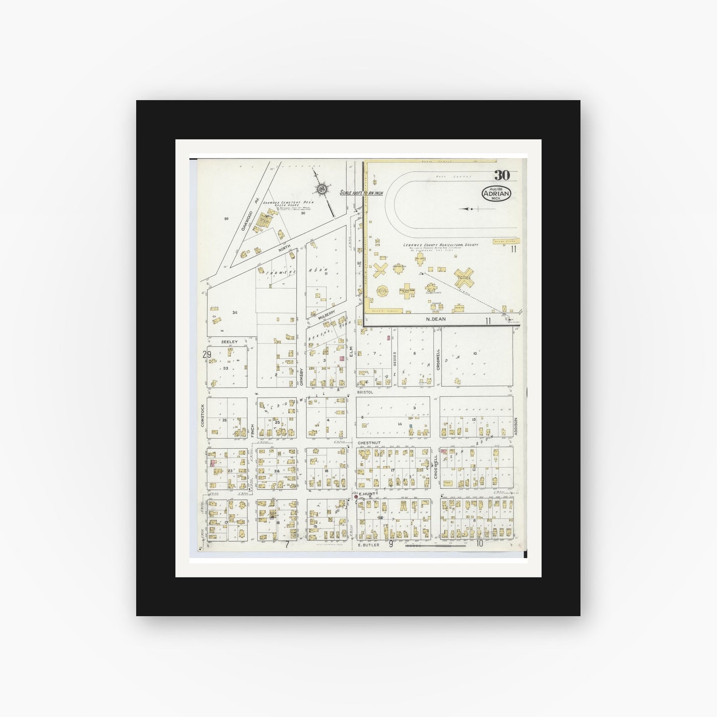 Old map wall art mockup — black gallery frame with white mat — Sanborn Fire Insurance Map from Adrian, Lenawee County, Michigan (1916), Sheet #0030