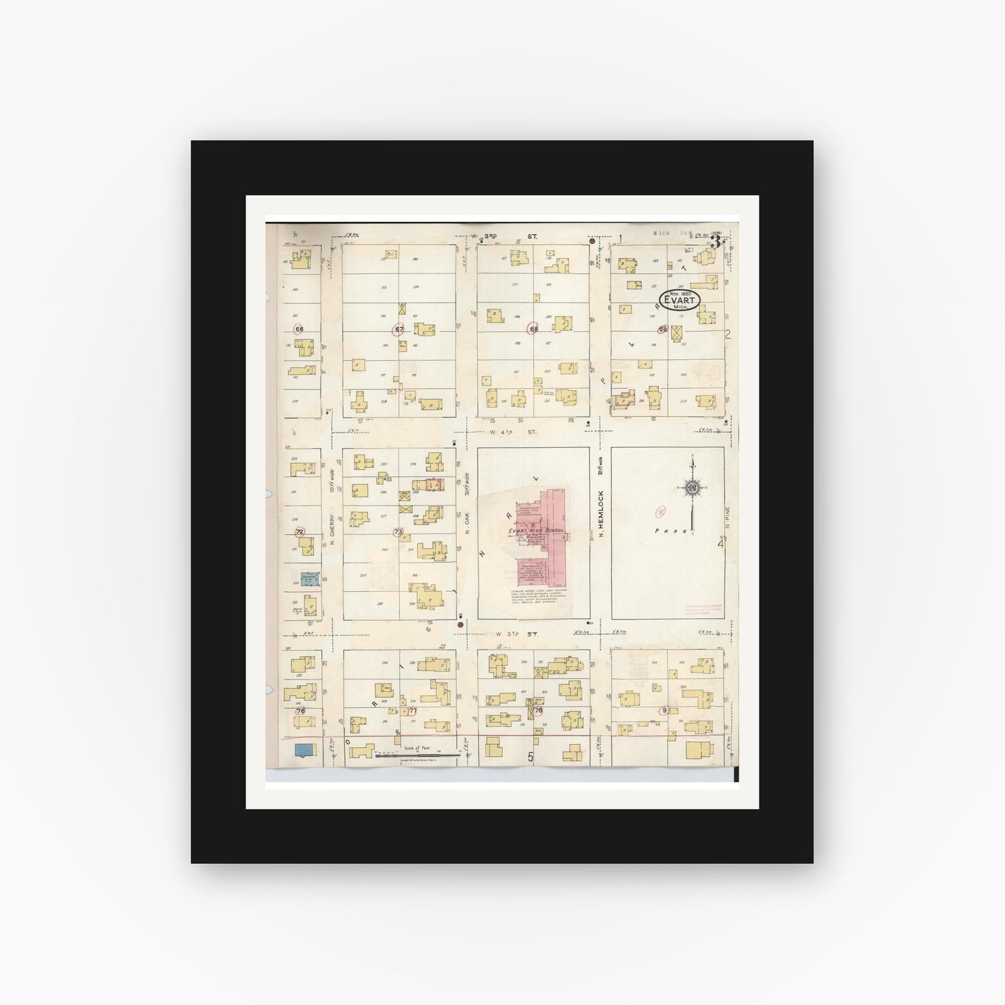 Old map wall art mockup — black gallery frame with white mat — Sanborn Fire Insurance Map from Evart, Osceola County, Michigan (1942), Sheet #0003