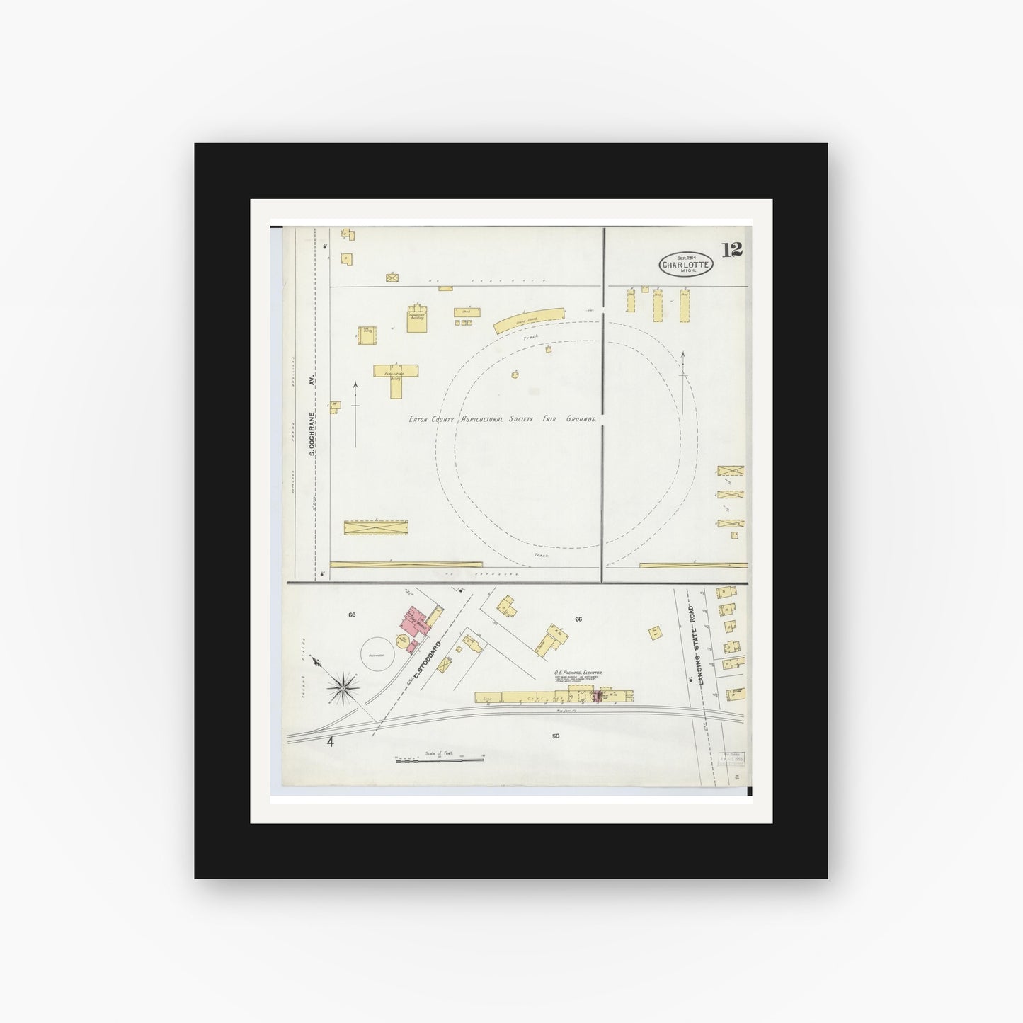 Old map wall art mockup — black gallery frame with white mat — Sanborn Fire Insurance Map from Charlotte, Eaton County, Michigan (1904), Sheet #0012
