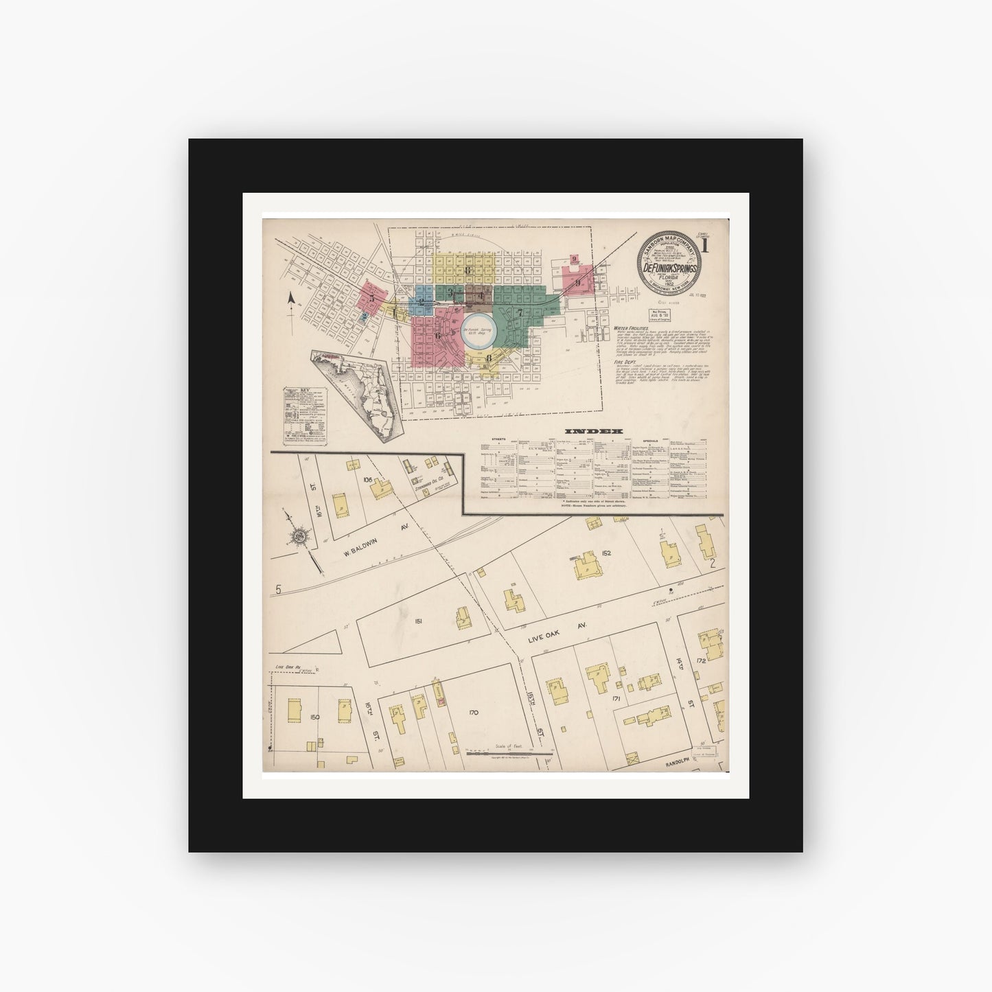 Old map wall art mockup — black gallery frame with white mat — Sanborn Fire Insurance Map from De Funiak Springs, Walton County, Florida (1922), Sheet #0001