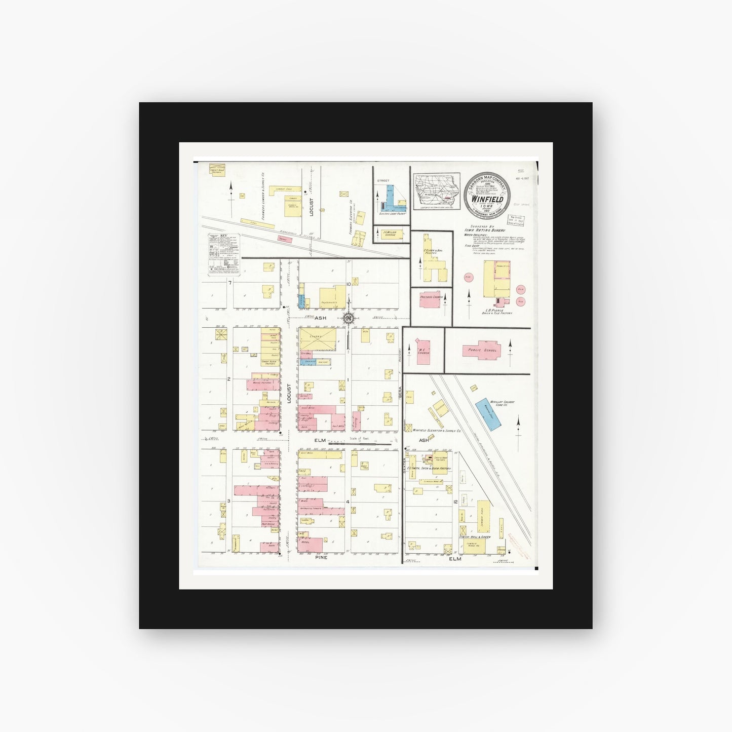 Old map wall art mockup — black gallery frame with white mat — Sanborn Fire Insurance Map from Winfield, Henry County, Iowa (1917), Sheet #0001