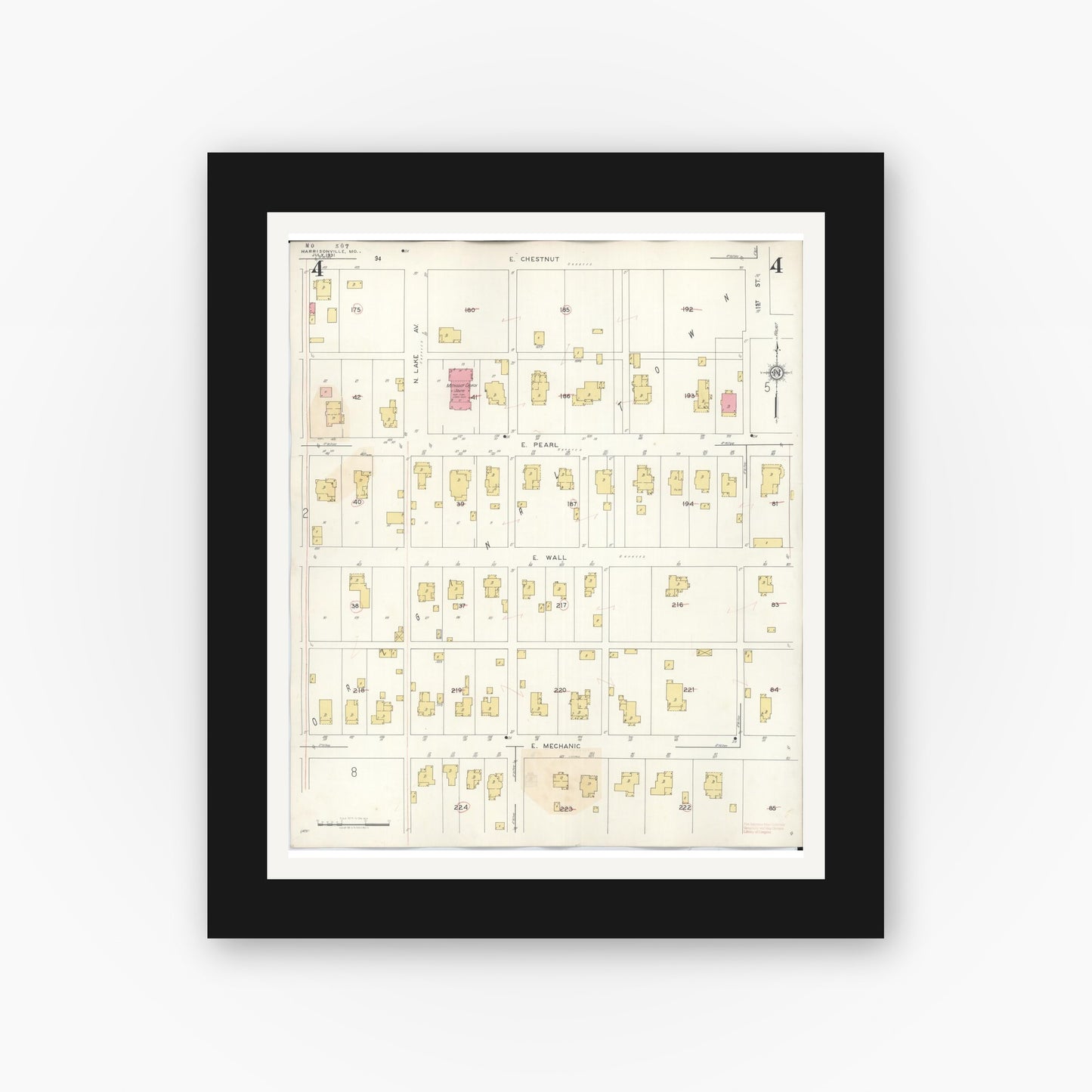 Old map wall art mockup — black gallery frame with white mat — Sanborn Fire Insurance Map from Harrisonville, Cass County, Missouri (1939), Sheet #0004