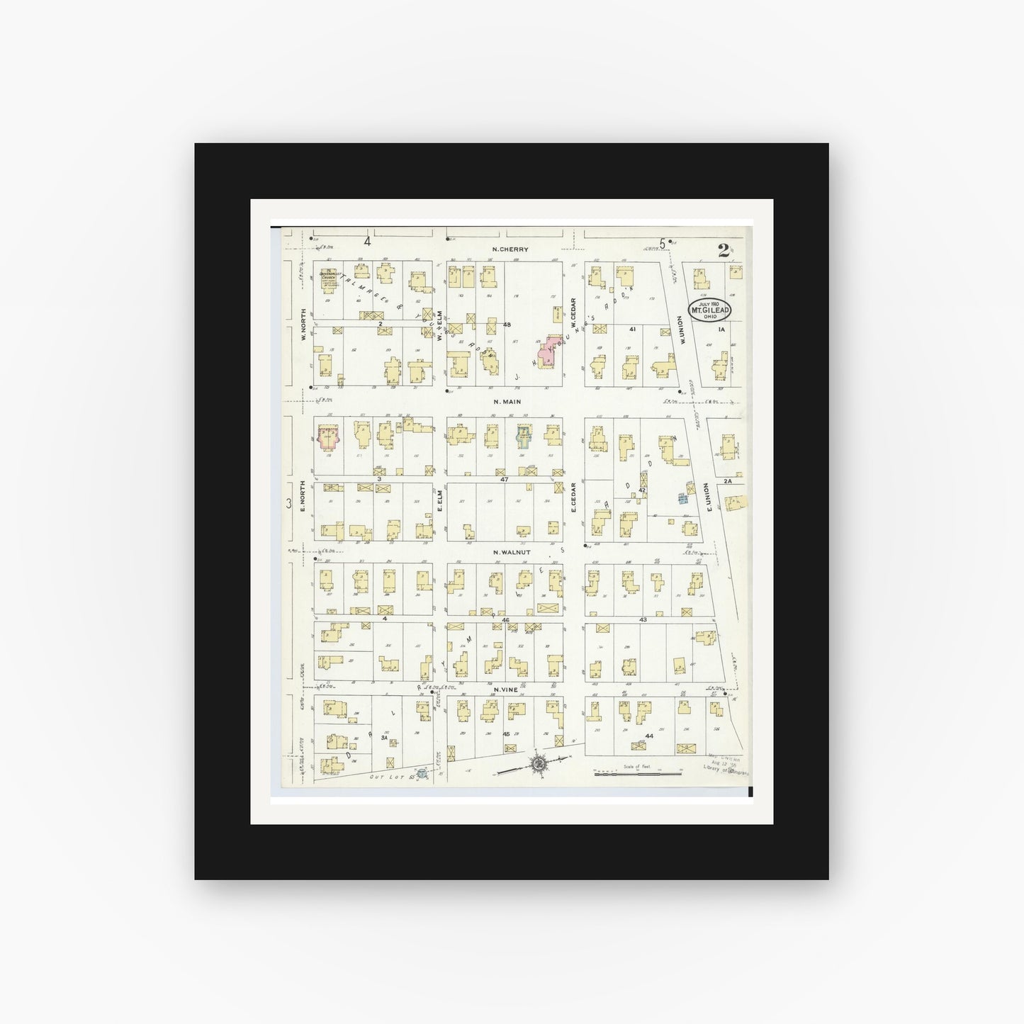 Old map wall art mockup — black gallery frame with white mat — Sanborn Fire Insurance Map from Mount Gilead, Morrow County, Ohio (1910), Sheet #0002