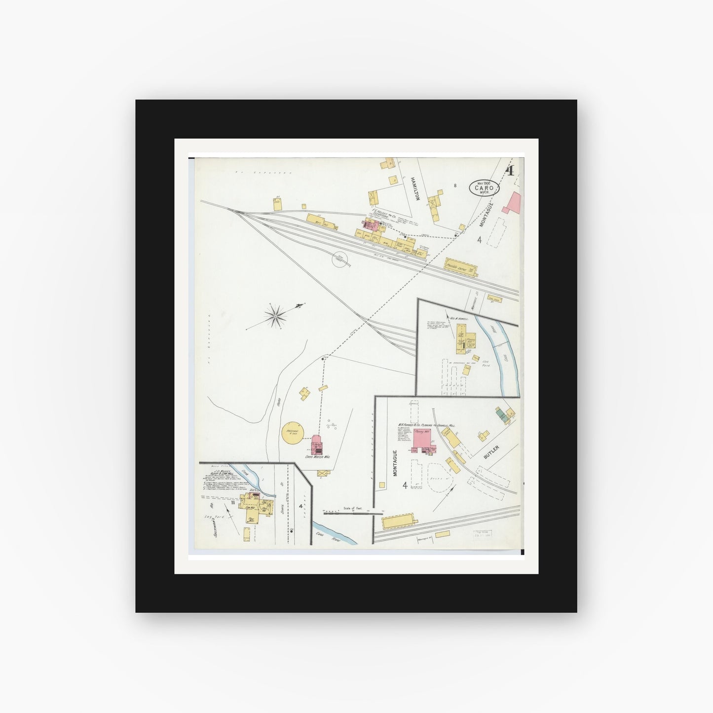 Old map wall art mockup — black gallery frame with white mat — Sanborn Fire Insurance Map from Caro, Tuscola County, Michigan (1900), Sheet #0004