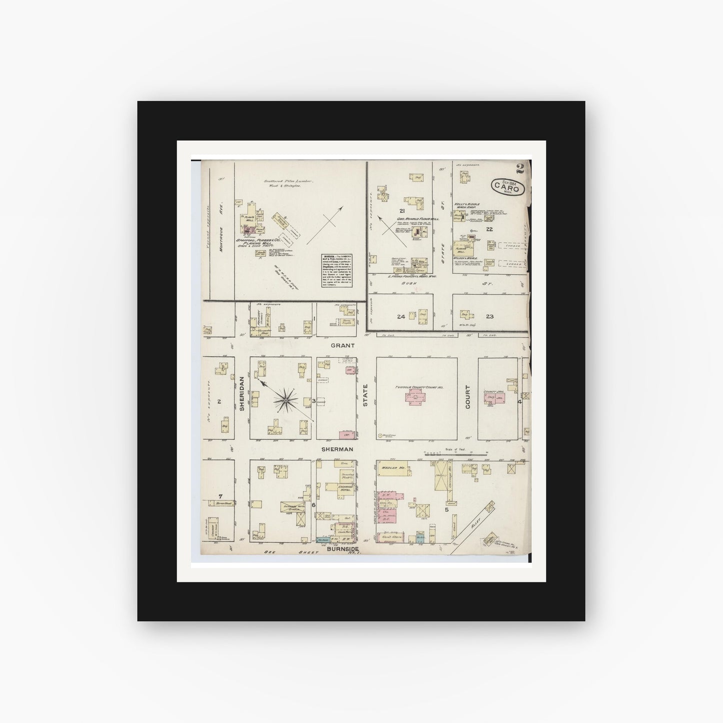 Old map wall art mockup — black gallery frame with white mat — Sanborn Fire Insurance Map from Caro, Tuscola County, Michigan (1884), Sheet #0002