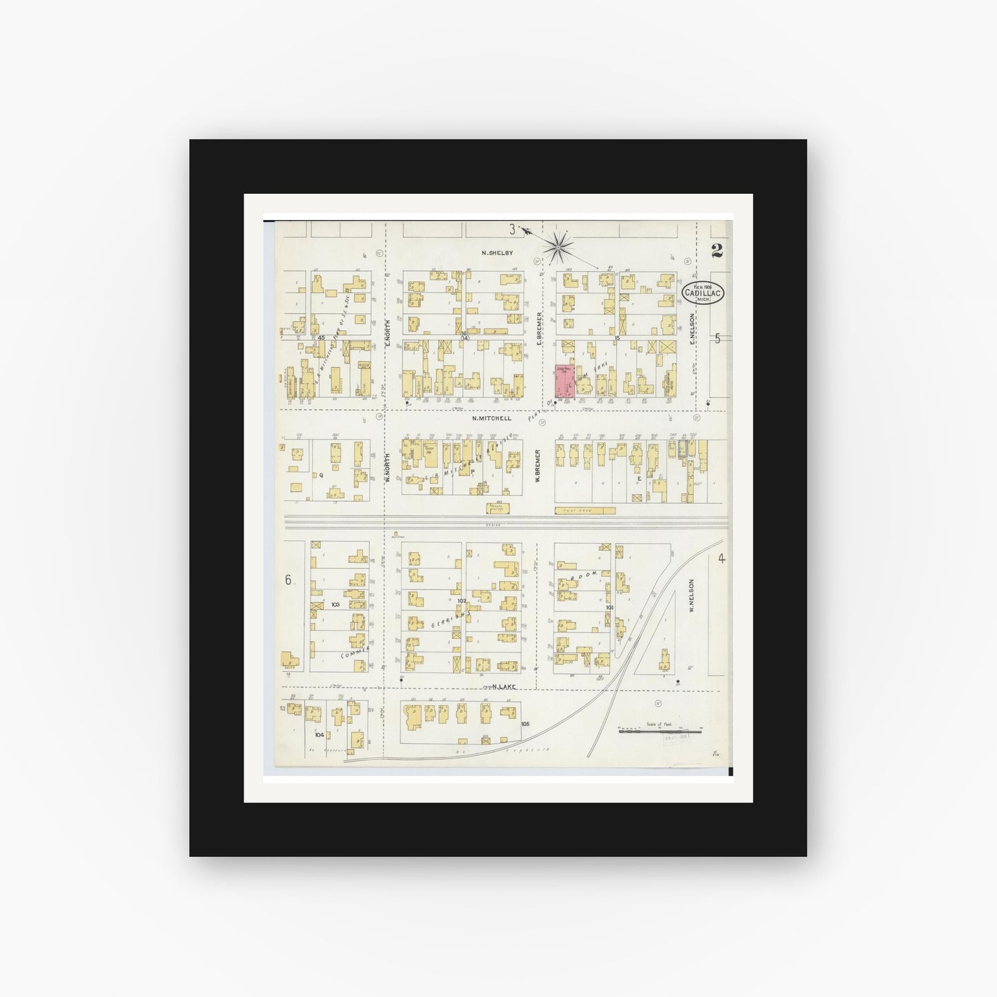 Old map wall art mockup — black gallery frame with white mat — Sanborn Fire Insurance Map from Cadillac, Wexford County, Michigan (1906), Sheet #0002