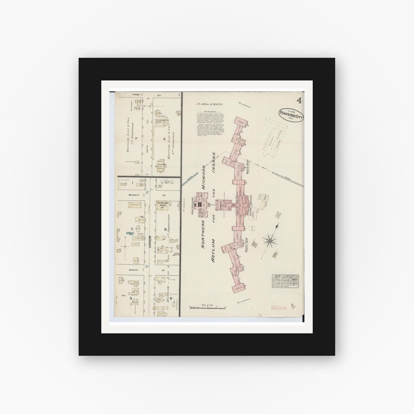 Old map wall art mockup — black gallery frame with white mat — Sanborn Fire Insurance Map from Traverse City, Grand Traverse County, Michigan (1884), Sheet #0004