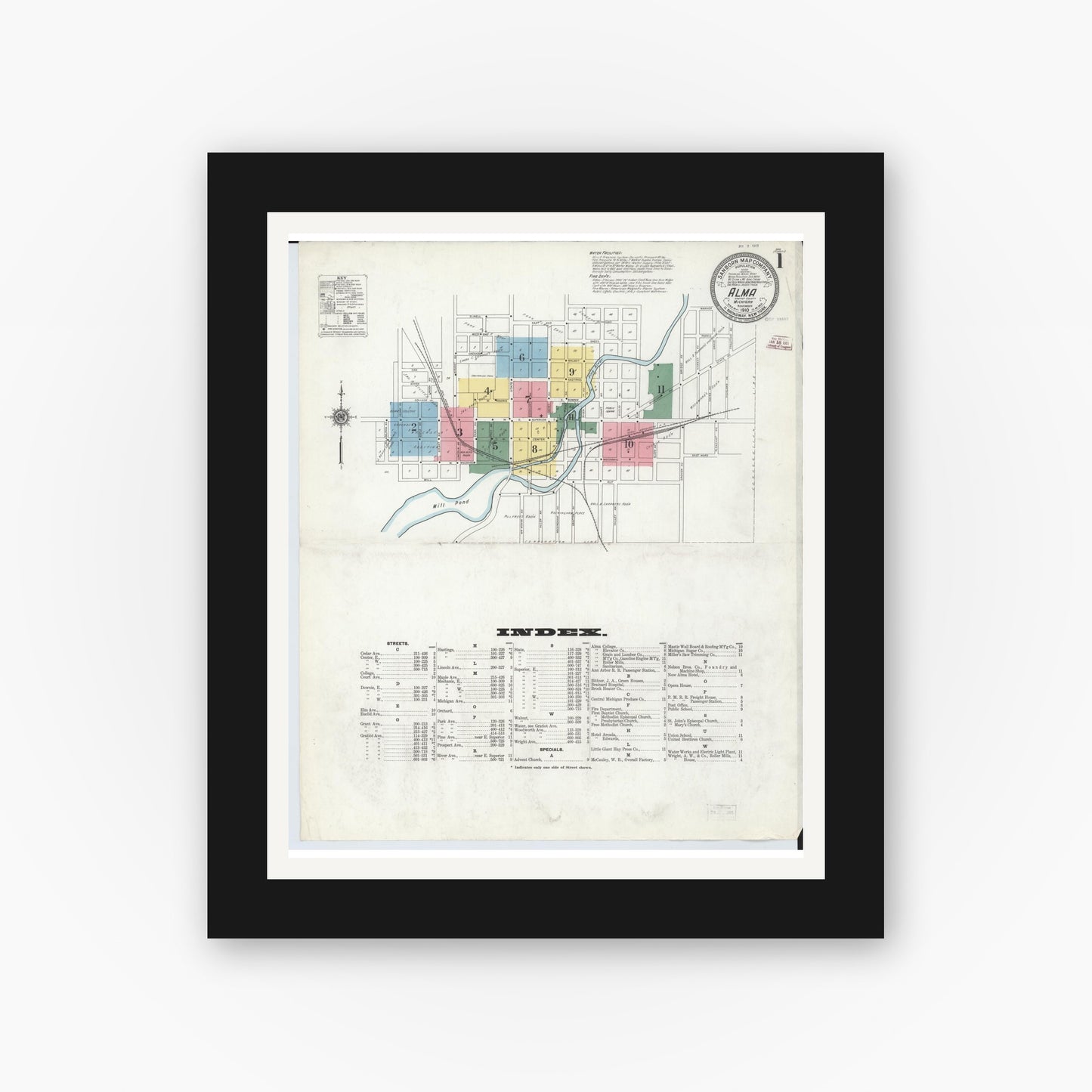 Old map wall art mockup — black gallery frame with white mat — Sanborn Fire Insurance Map from Alma, Gratiot County, Michigan (1910), Sheet #0001