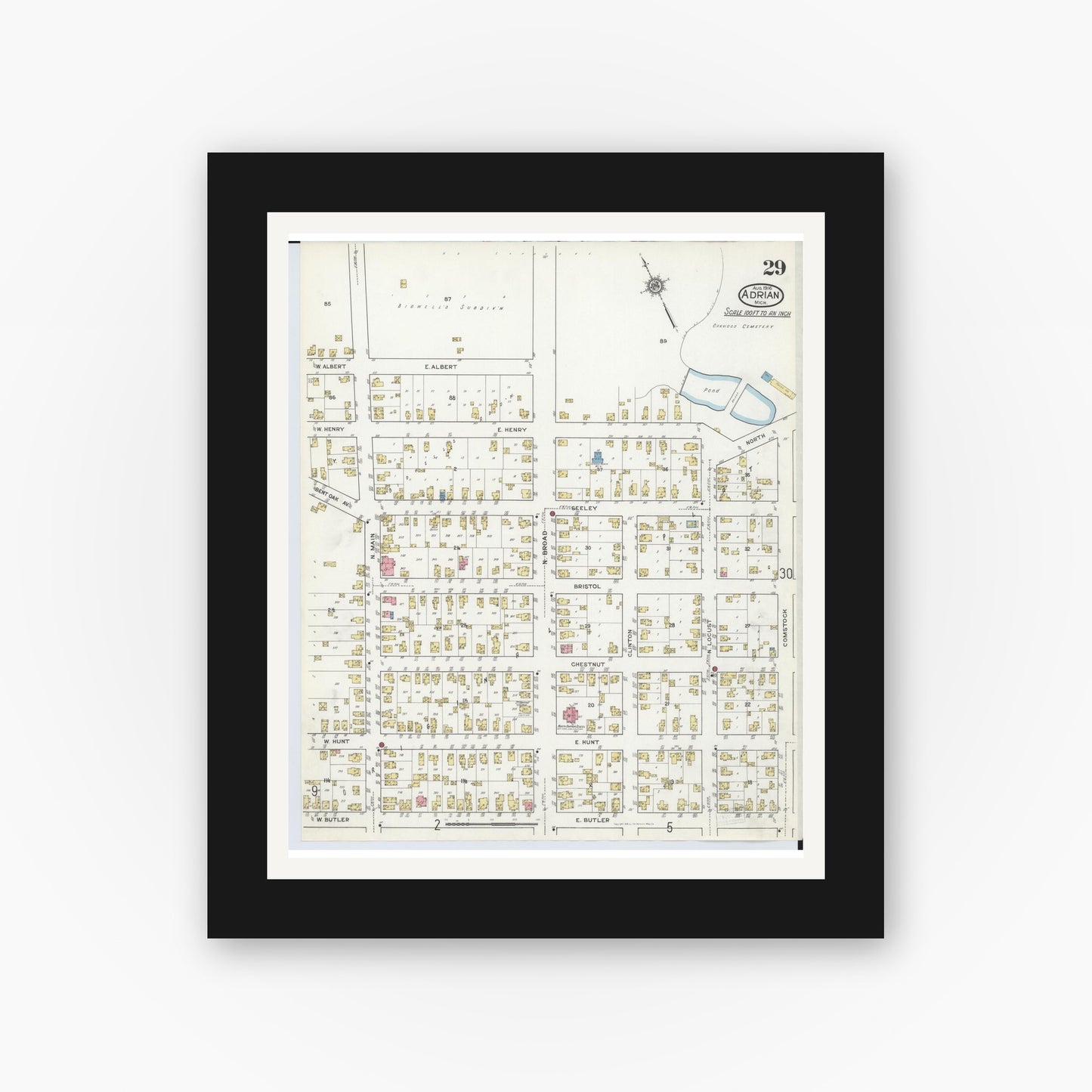 Old map wall art mockup — black gallery frame with white mat — Sanborn Fire Insurance Map from Adrian, Lenawee County, Michigan (1916), Sheet #0029