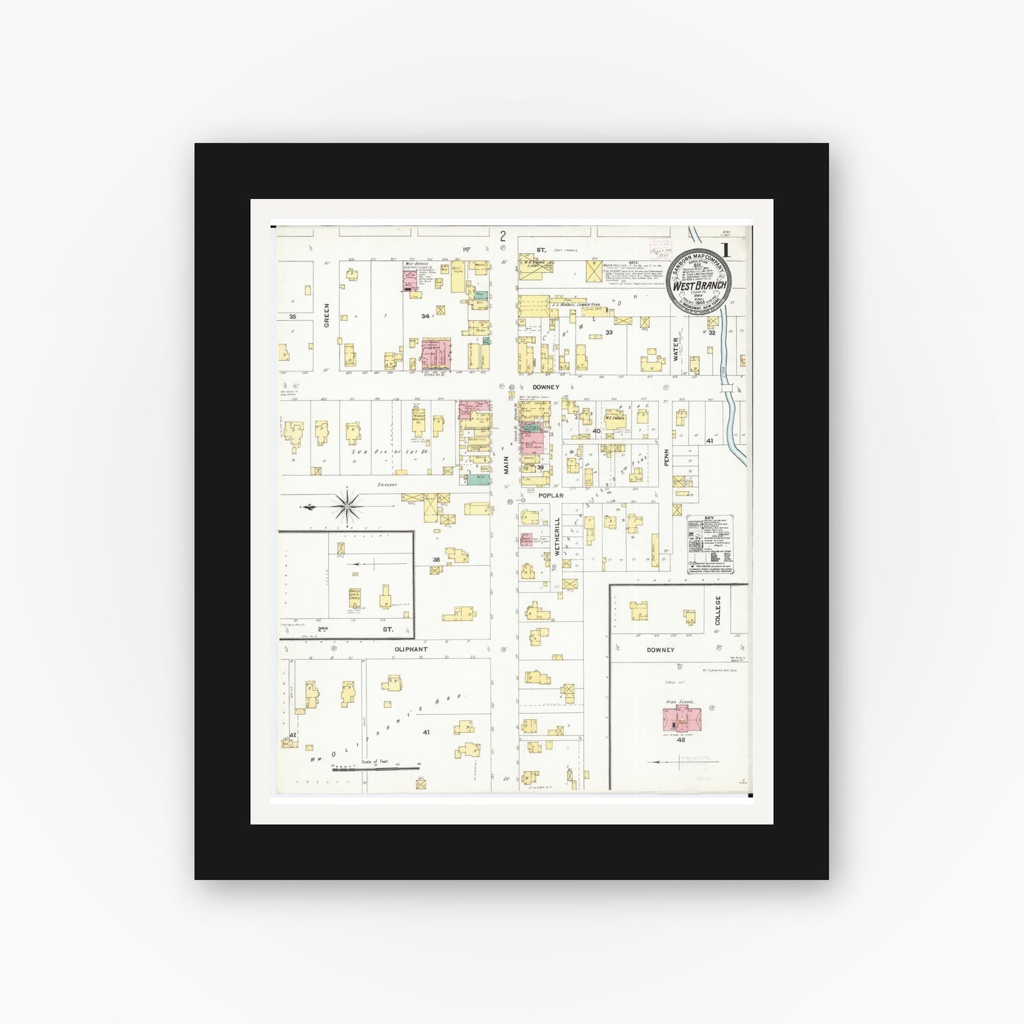 Old map wall art mockup — black gallery frame with white mat — Sanborn Fire Insurance Map from West Branch, Cedar County, Iowa (1906) — Complete Set
