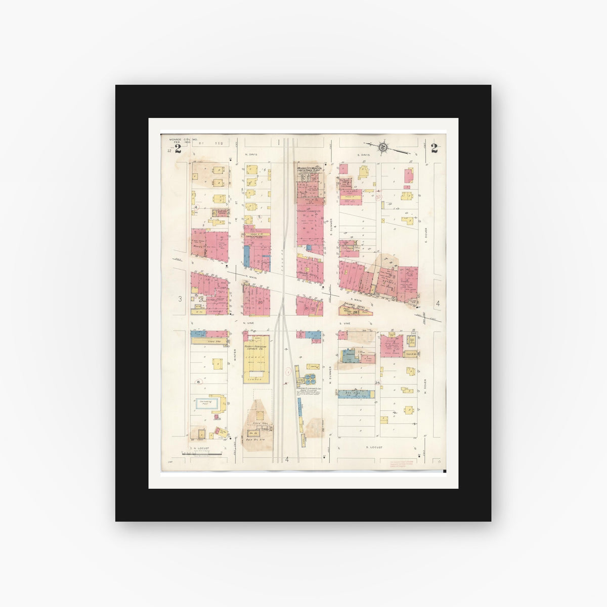 Old map wall art mockup — black gallery frame with white mat — Sanborn Fire Insurance Map from Monroe City, Monroe County, Missouri (1943), Sheet #0002