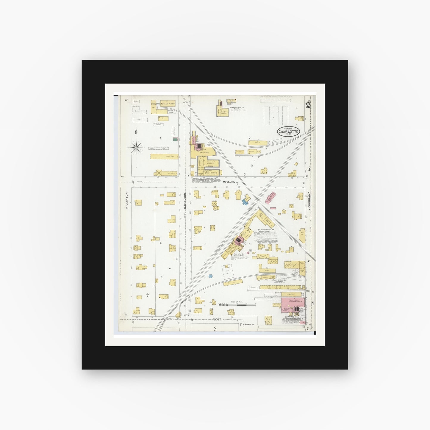 Old map wall art mockup — black gallery frame with white mat — Sanborn Fire Insurance Map from Charlotte, Eaton County, Michigan (1904), Sheet #0002