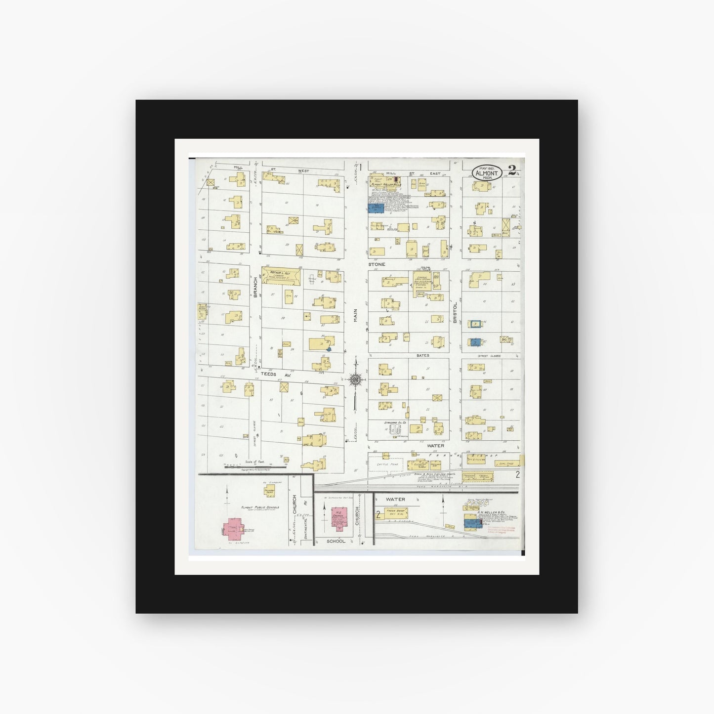 Old map wall art mockup — black gallery frame with white mat — Sanborn Fire Insurance Map from Almont, Lapeer County, Michigan (1921), Sheet #0002