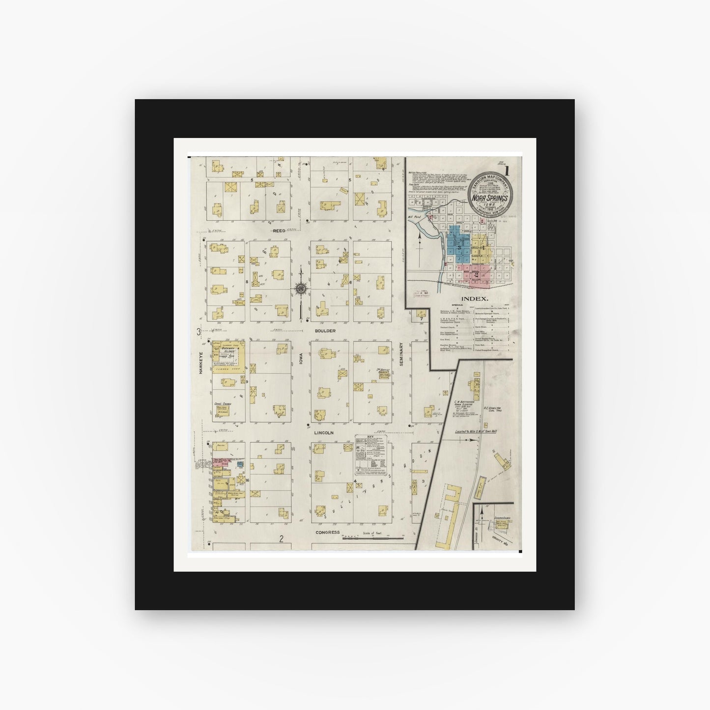 Old map wall art mockup — black gallery frame with white mat — Sanborn Fire Insurance Map from Nora Springs, Floyd County, Iowa (1910) — Complete Set