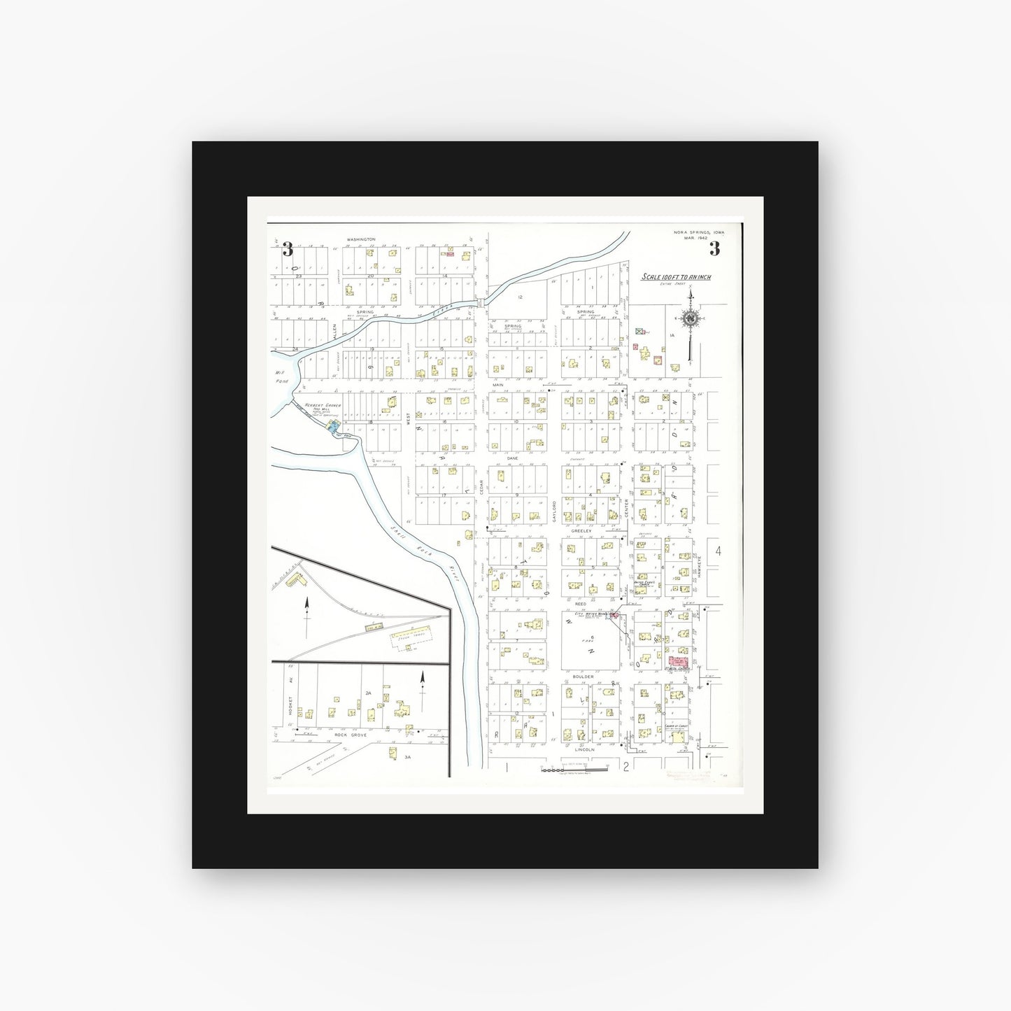 Old map wall art mockup — black gallery frame with white mat — Sanborn Fire Insurance Map from Nora Springs, Floyd County, Iowa (1942), Sheet #0003