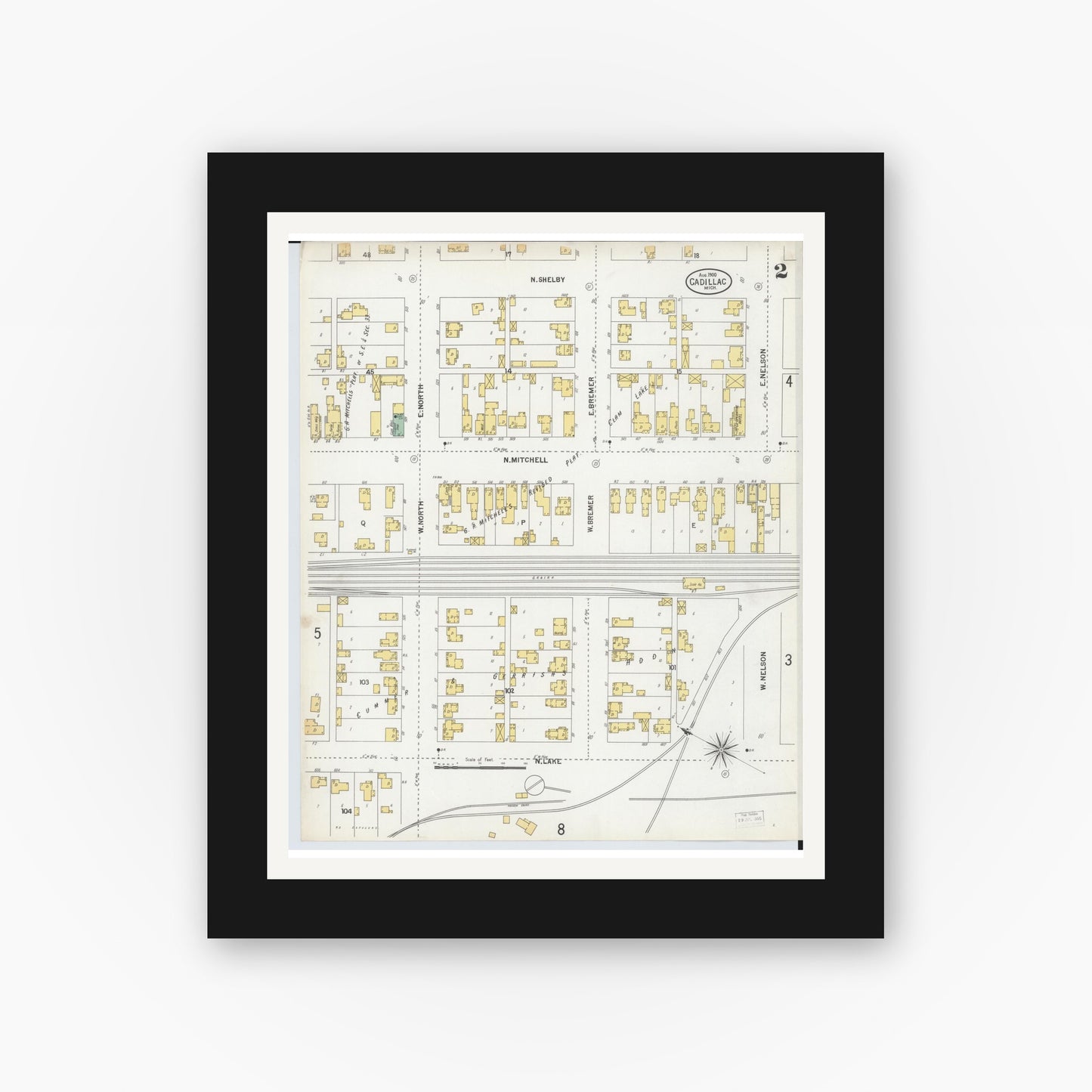 Old map wall art mockup — black gallery frame with white mat — Sanborn Fire Insurance Map from Cadillac, Wexford County, Michigan (1900), Sheet #0002