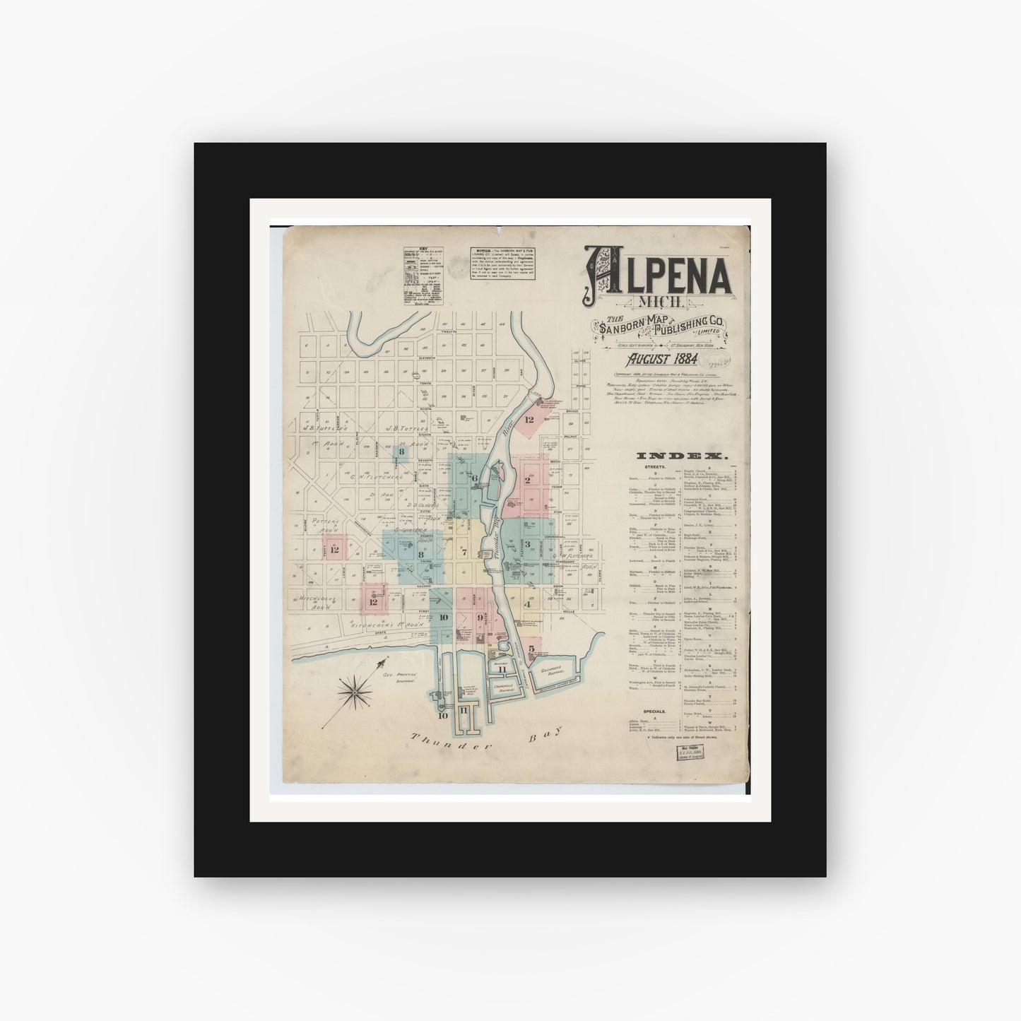 Old map wall art mockup — black gallery frame with white mat — Sanborn Fire Insurance Map from Alpena, Alpena County, Michigan (1884), Sheet #0001