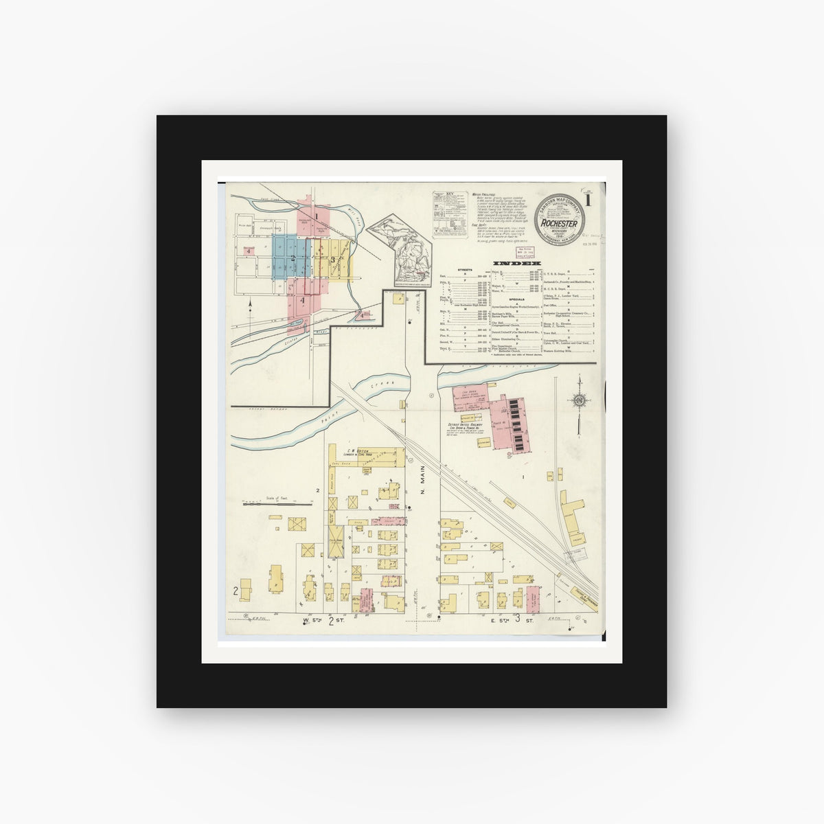 Old map wall art mockup — black gallery frame with white mat — Sanborn Fire Insurance Map from Rochester, Oakland County, Michigan (1916), Sheet #0001