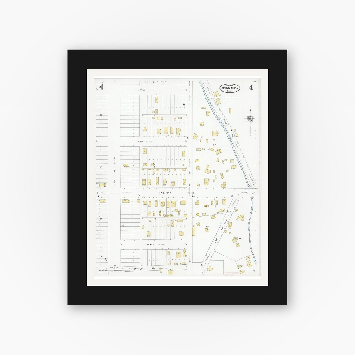Old map wall art mockup — black gallery frame with white mat — Sanborn Fire Insurance Map from Mountain Iron, Saint Louis County, Minnesota (1928), Sheet #0004