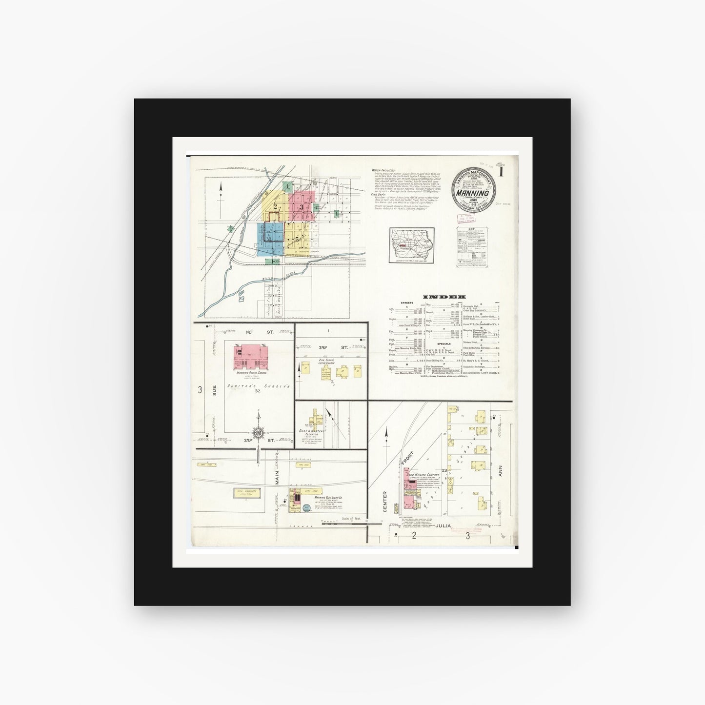Old map wall art mockup — black gallery frame with white mat — Sanborn Fire Insurance Map from Manning, Carroll County, Iowa (1913) — Complete Set