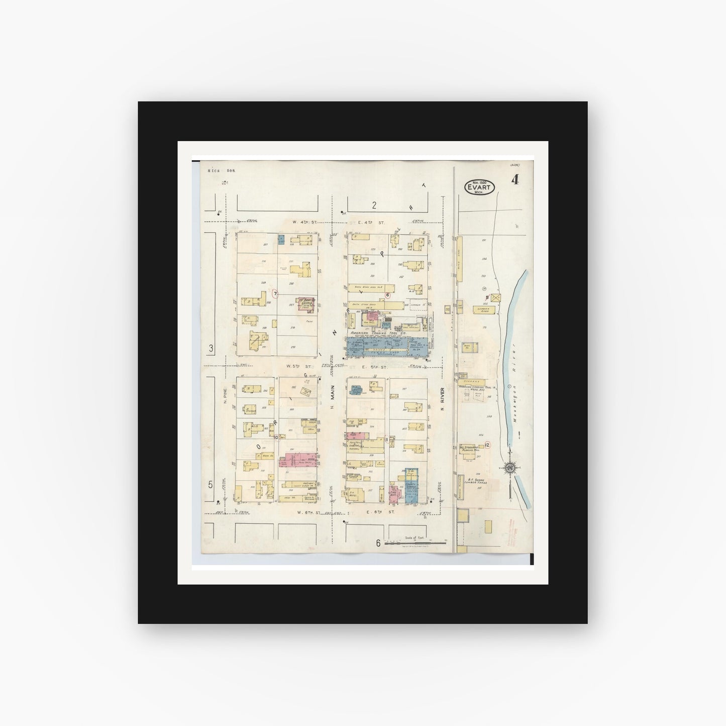 Old map wall art mockup — black gallery frame with white mat — Sanborn Fire Insurance Map from Evart, Osceola County, Michigan (1942), Sheet #0004
