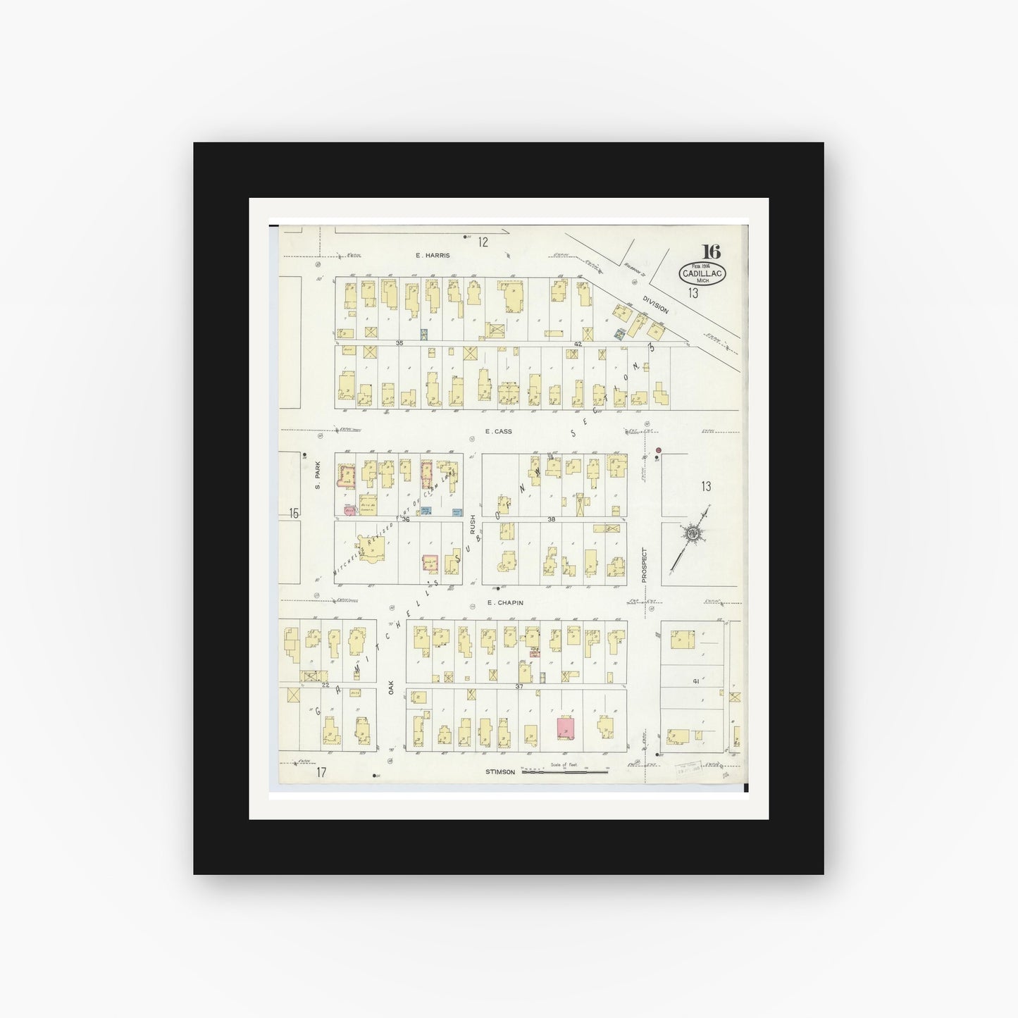 Old map wall art mockup — black gallery frame with white mat — Sanborn Fire Insurance Map from Cadillac, Wexford County, Michigan (1914), Sheet #0016