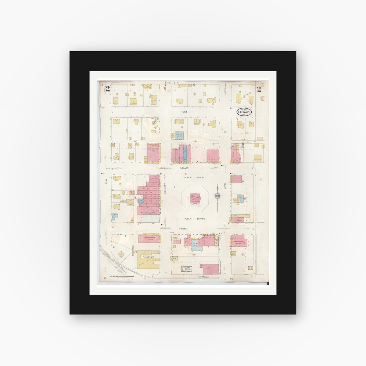 Old map wall art mockup — black gallery frame with white mat — Sanborn Fire Insurance Map from Leonard, Fannin County, Texas (1945), Sheet #0002