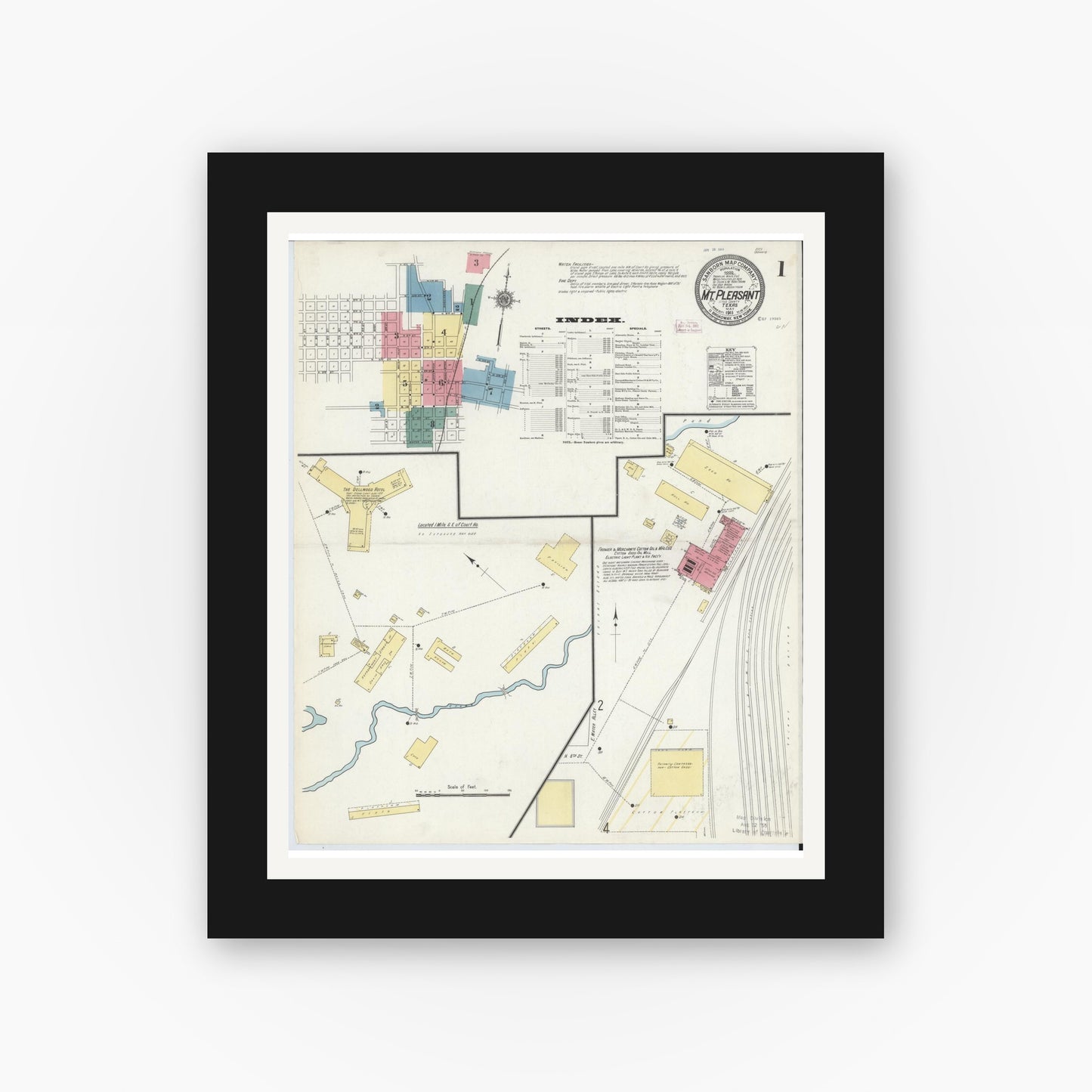 Old map wall art mockup — black gallery frame with white mat — Sanborn Fire Insurance Map from Mount Pleasant, Titus County, Texas (1911), Sheet #0001