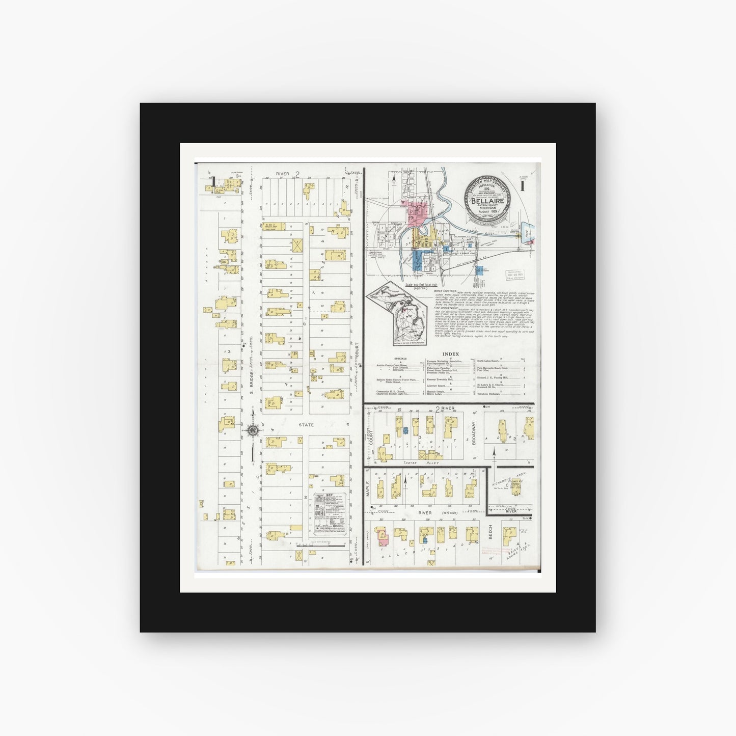 Old map wall art mockup — black gallery frame with white mat — Sanborn Fire Insurance Map from Bellaire, Antrim County, Michigan (1929), Sheet #0001