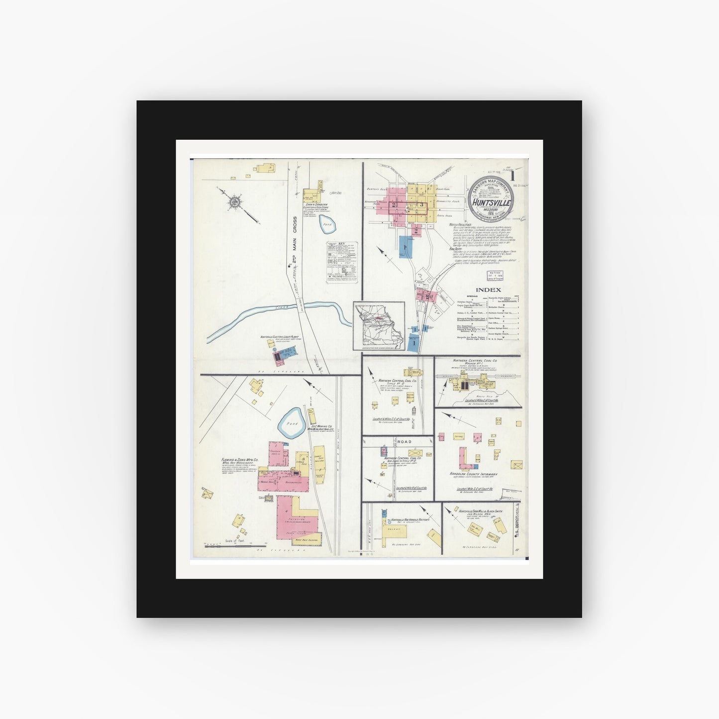 Old map wall art mockup — black gallery frame with white mat — Sanborn Fire Insurance Map from Huntsville, Randolph County, Missouri (1916), Sheet #0001