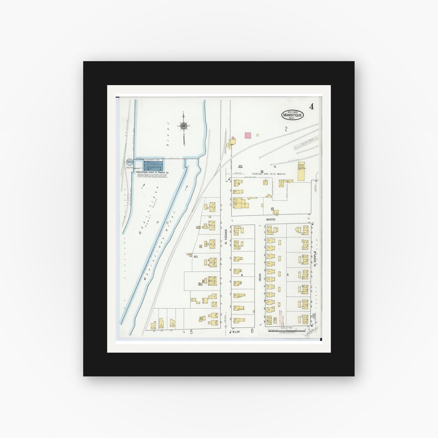 Old map wall art mockup — black gallery frame with white mat — Sanborn Fire Insurance Map from Manistique, Schoolcraft County, Michigan (1920), Sheet #0004