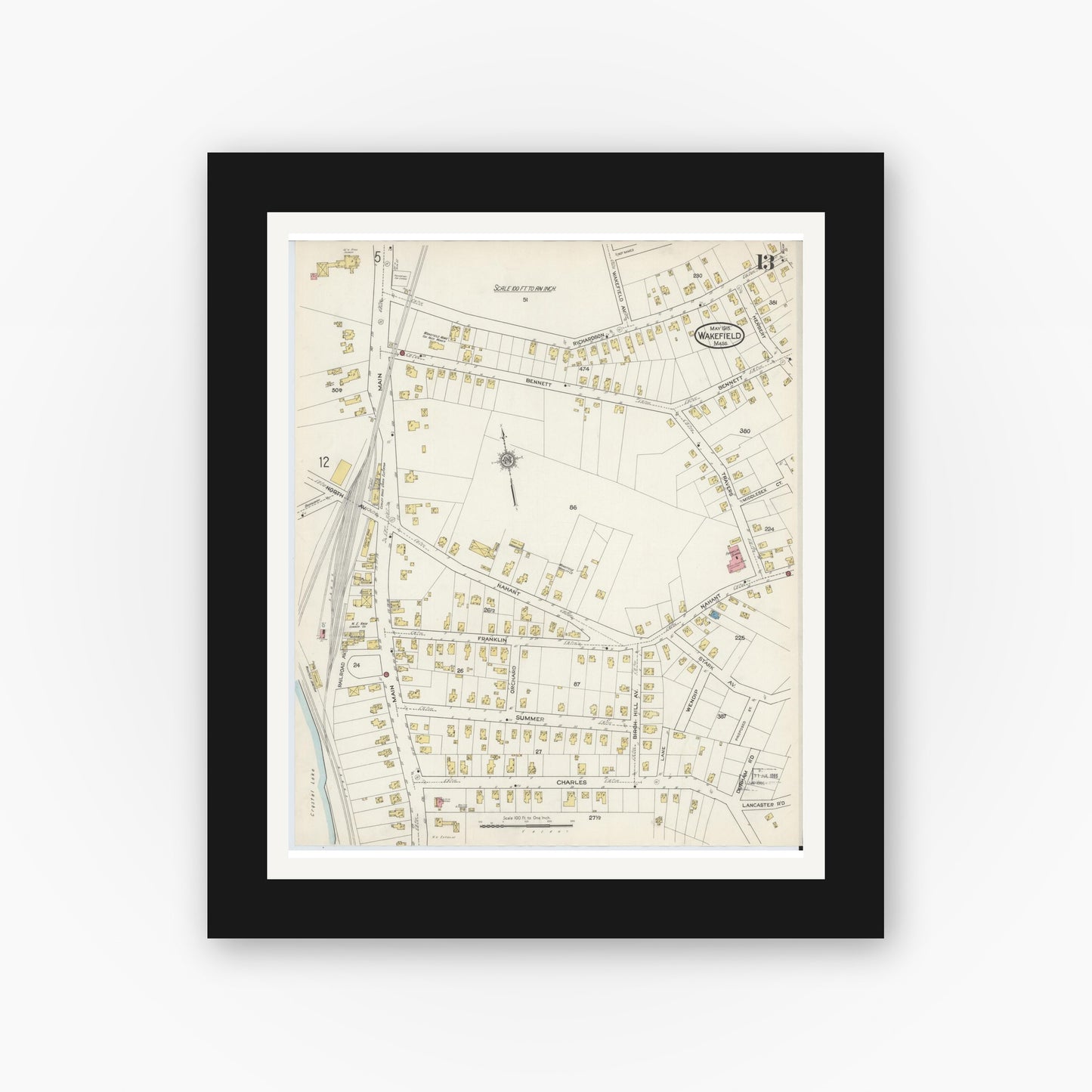 Old map wall art mockup — black gallery frame with white mat — Sanborn Fire Insurance Map from Wakefield, Middlesex County, Massachusetts (1915), Sheet #0013