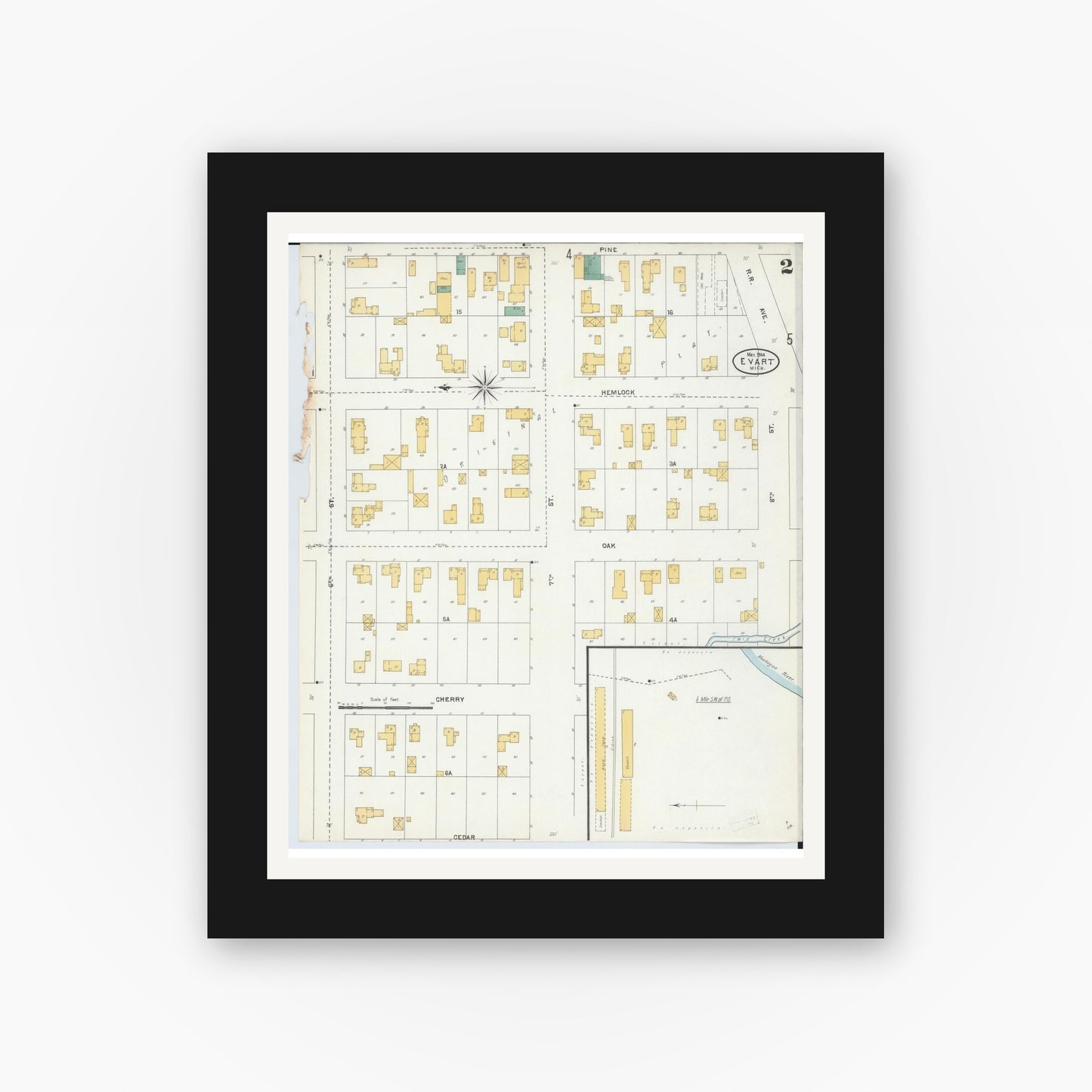 Old map wall art mockup — black gallery frame with white mat — Sanborn Fire Insurance Map from Evart, Osceola County, Michigan (1904), Sheet #0002