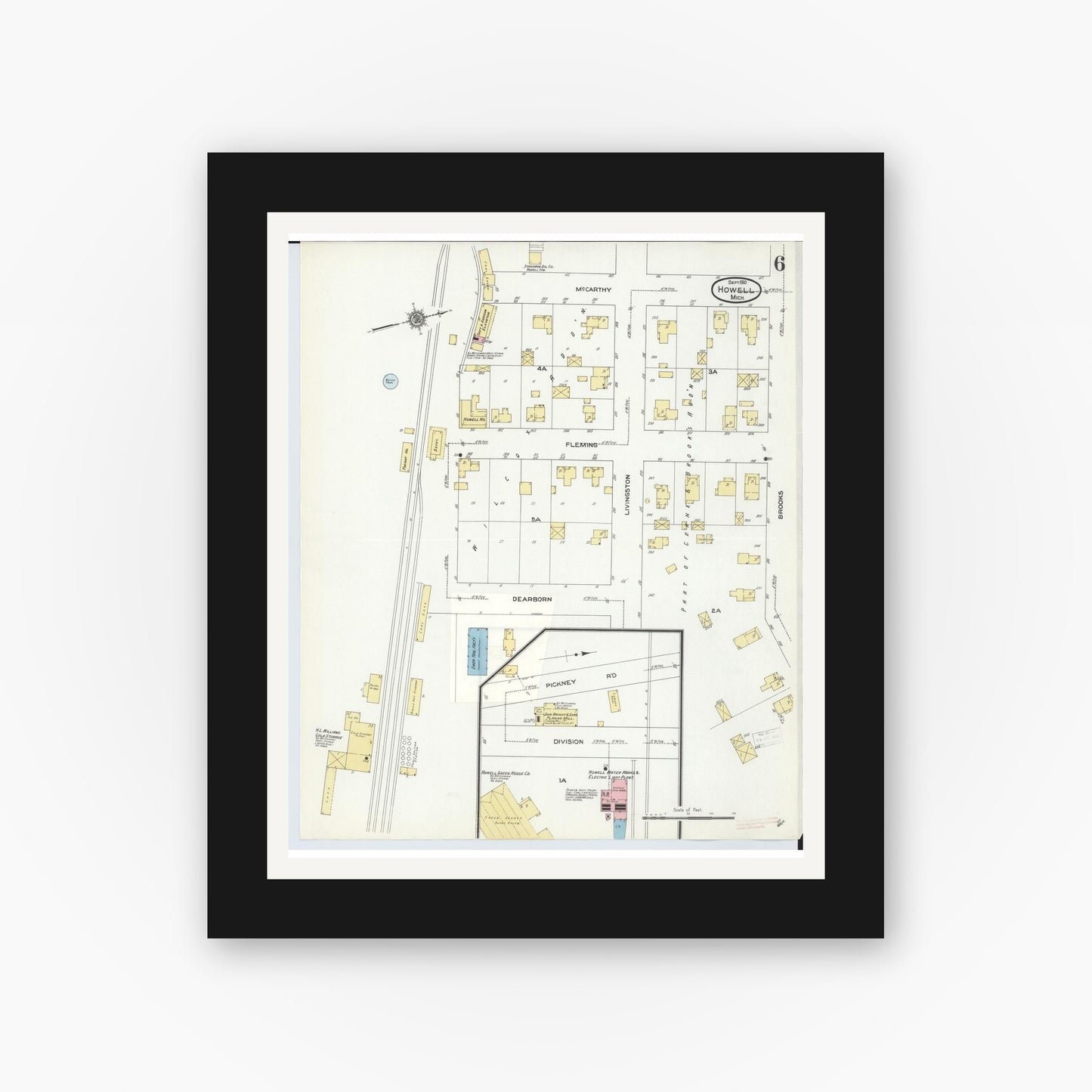 Old map wall art mockup — black gallery frame with white mat — Sanborn Fire Insurance Map from Howell, Livingston County, Michigan (1910), Sheet #0006