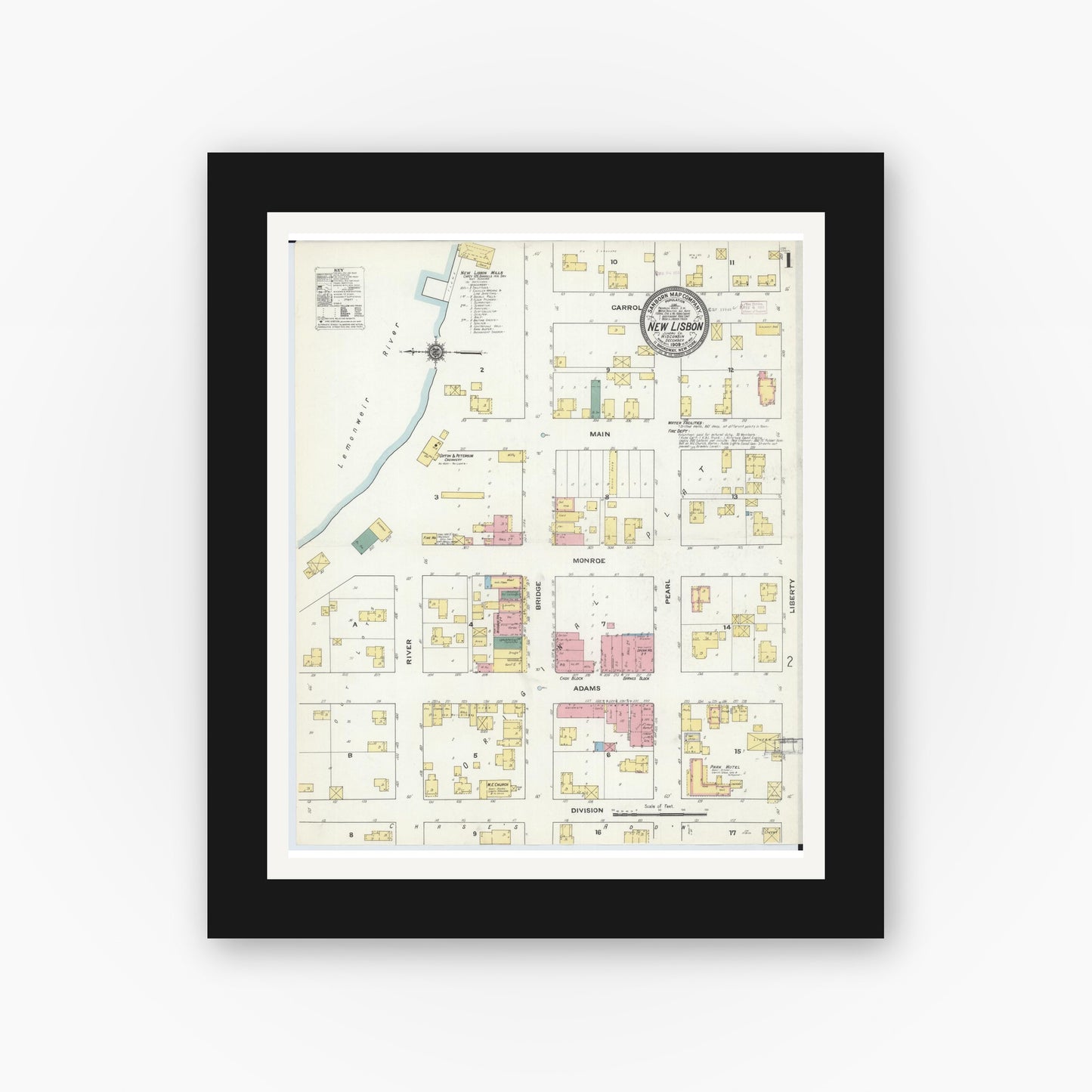 Old map wall art mockup — black gallery frame with white mat — Sanborn Fire Insurance Map from New Lisbon, Juneau County, Wisconsin (1909), Sheet #0001