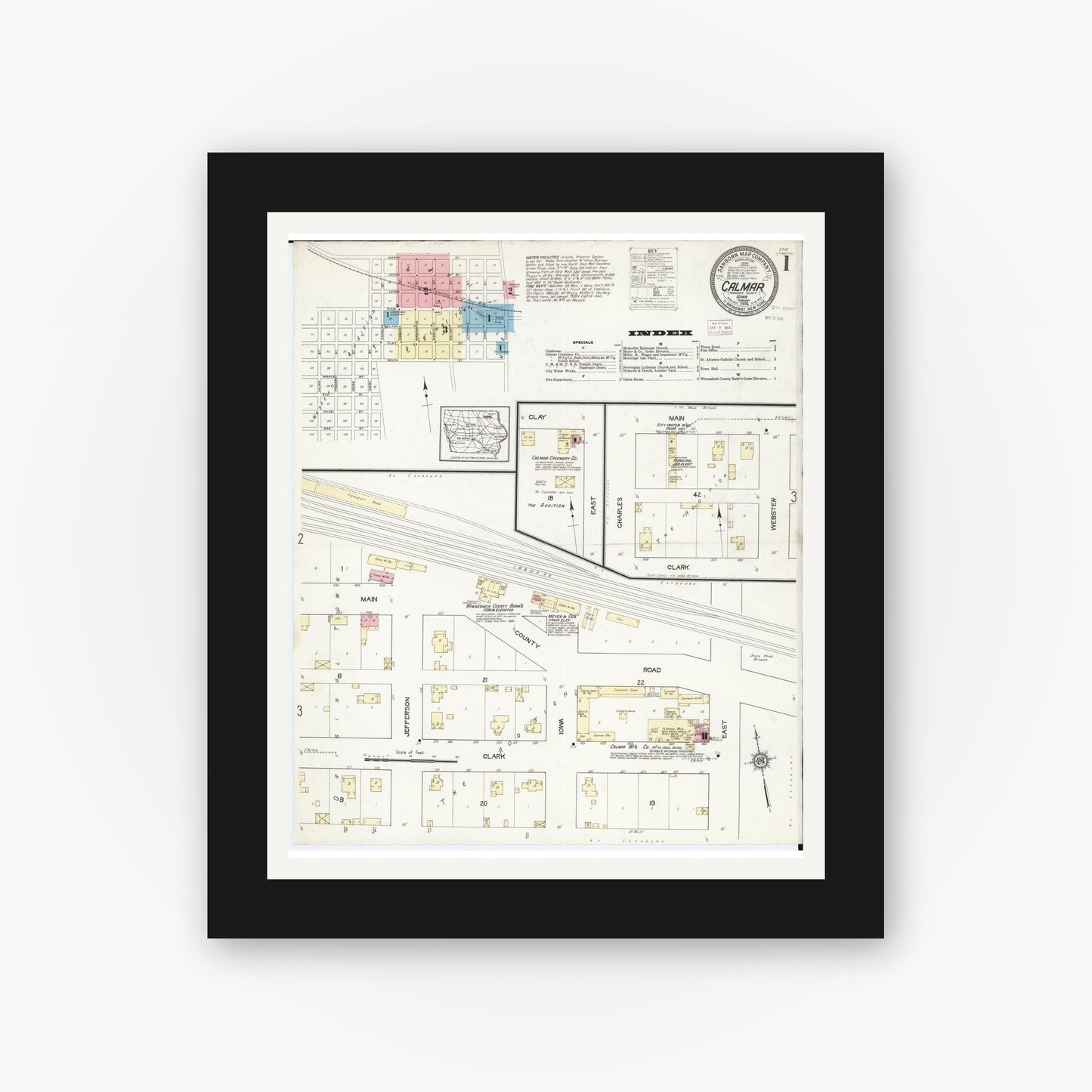 Old map wall art mockup — black gallery frame with white mat — Sanborn Fire Insurance Map from Calmar, Winneshiek County, Iowa (1914) — Complete Set