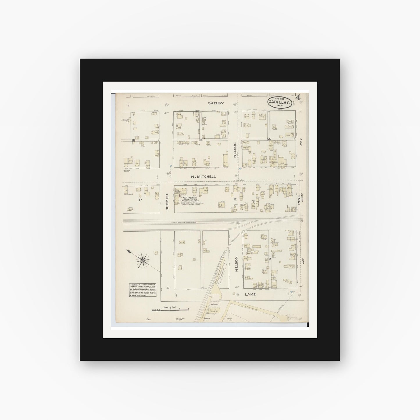 Old map wall art mockup — black gallery frame with white mat — Sanborn Fire Insurance Map from Cadillac, Wexford County, Michigan (1884), Sheet #0004