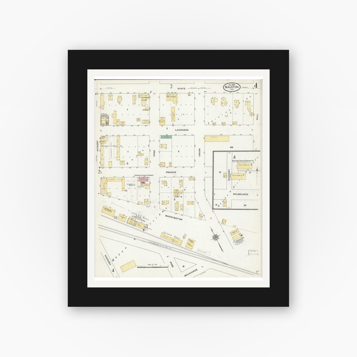 Old map wall art mockup — black gallery frame with white mat — Sanborn Fire Insurance Map from Mauston, Juneau County, Wisconsin (1909), Sheet #0004