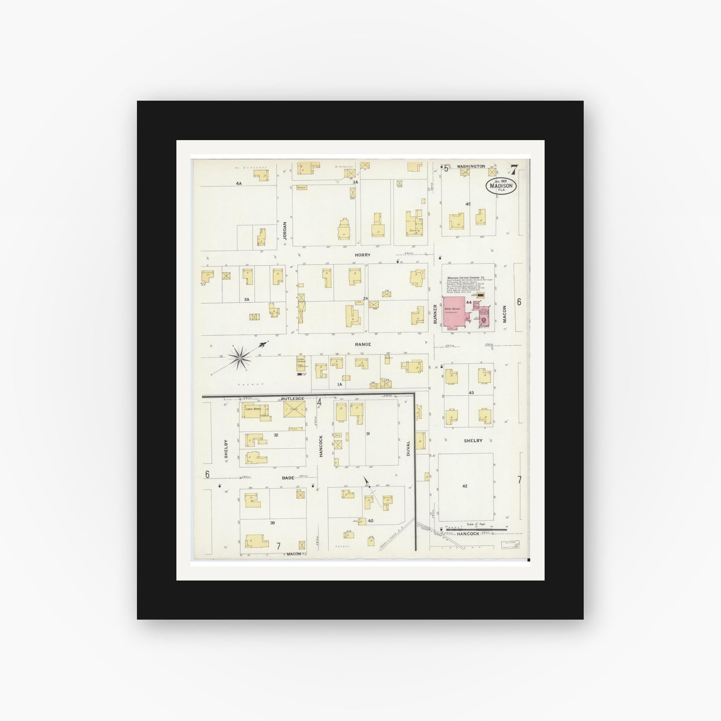 Old map wall art mockup — black gallery frame with white mat — Sanborn Fire Insurance Map from Madison, Madison County, Florida (1909), Sheet #0007
