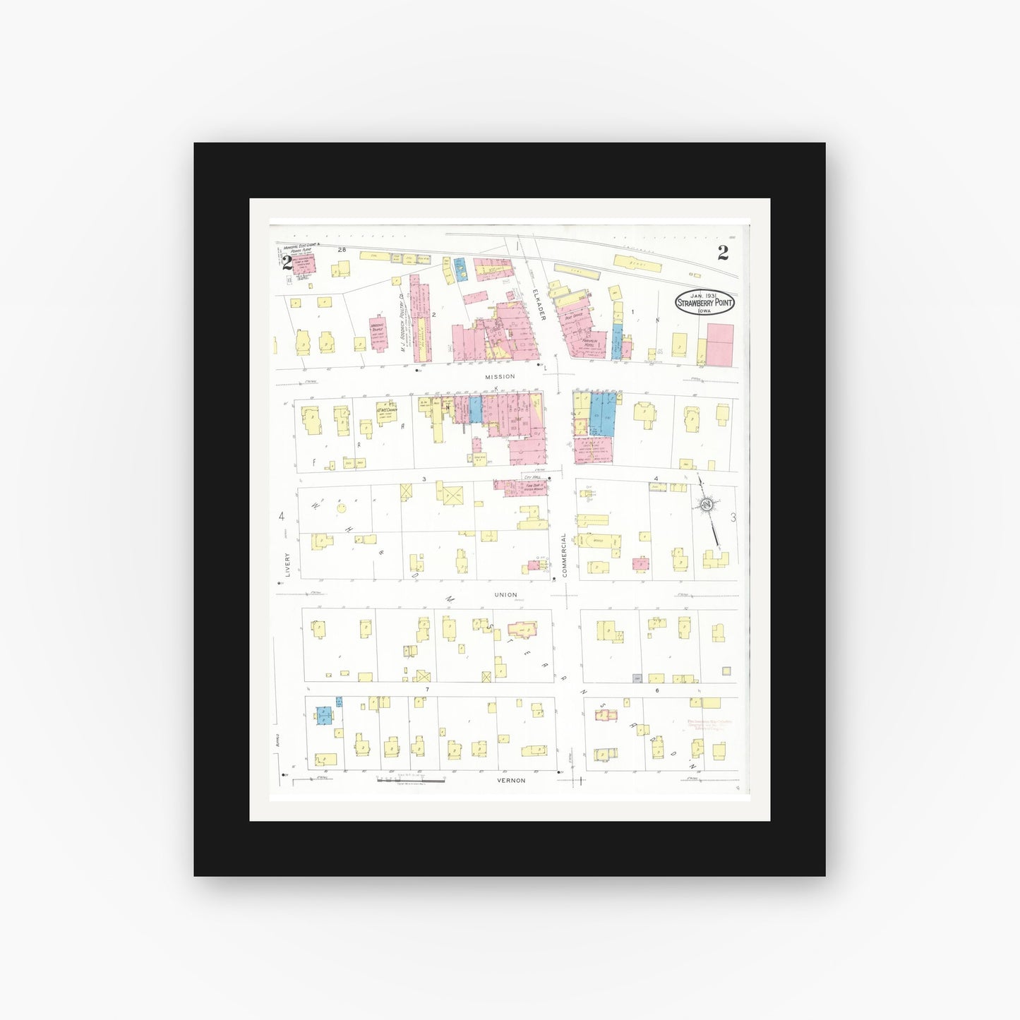 Old map wall art mockup — black gallery frame with white mat — Sanborn Fire Insurance Map from Strawberry Point, Clayton County, Iowa (1931), Sheet #0002
