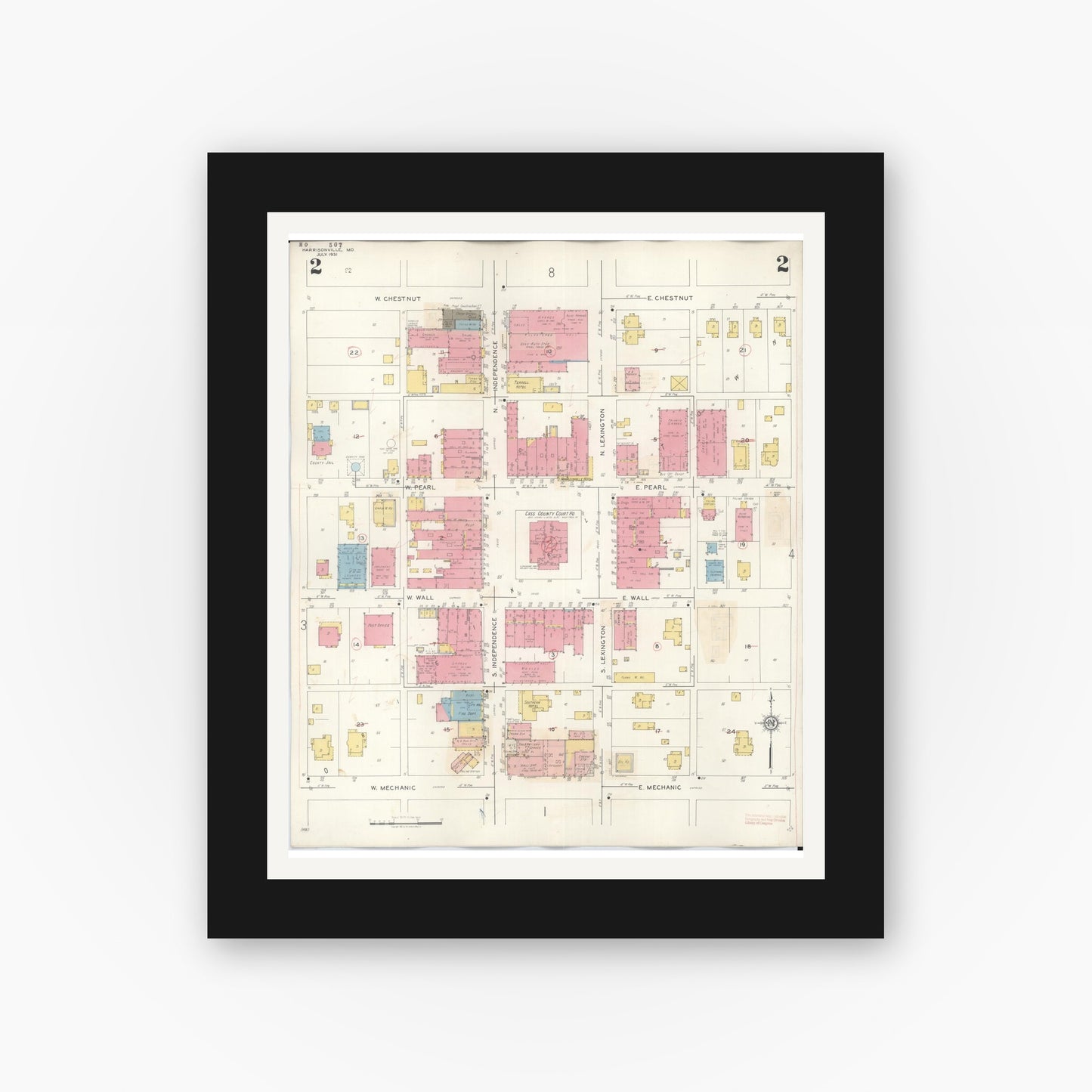 Old map wall art mockup — black gallery frame with white mat — Sanborn Fire Insurance Map from Harrisonville, Cass County, Missouri (1939), Sheet #0002