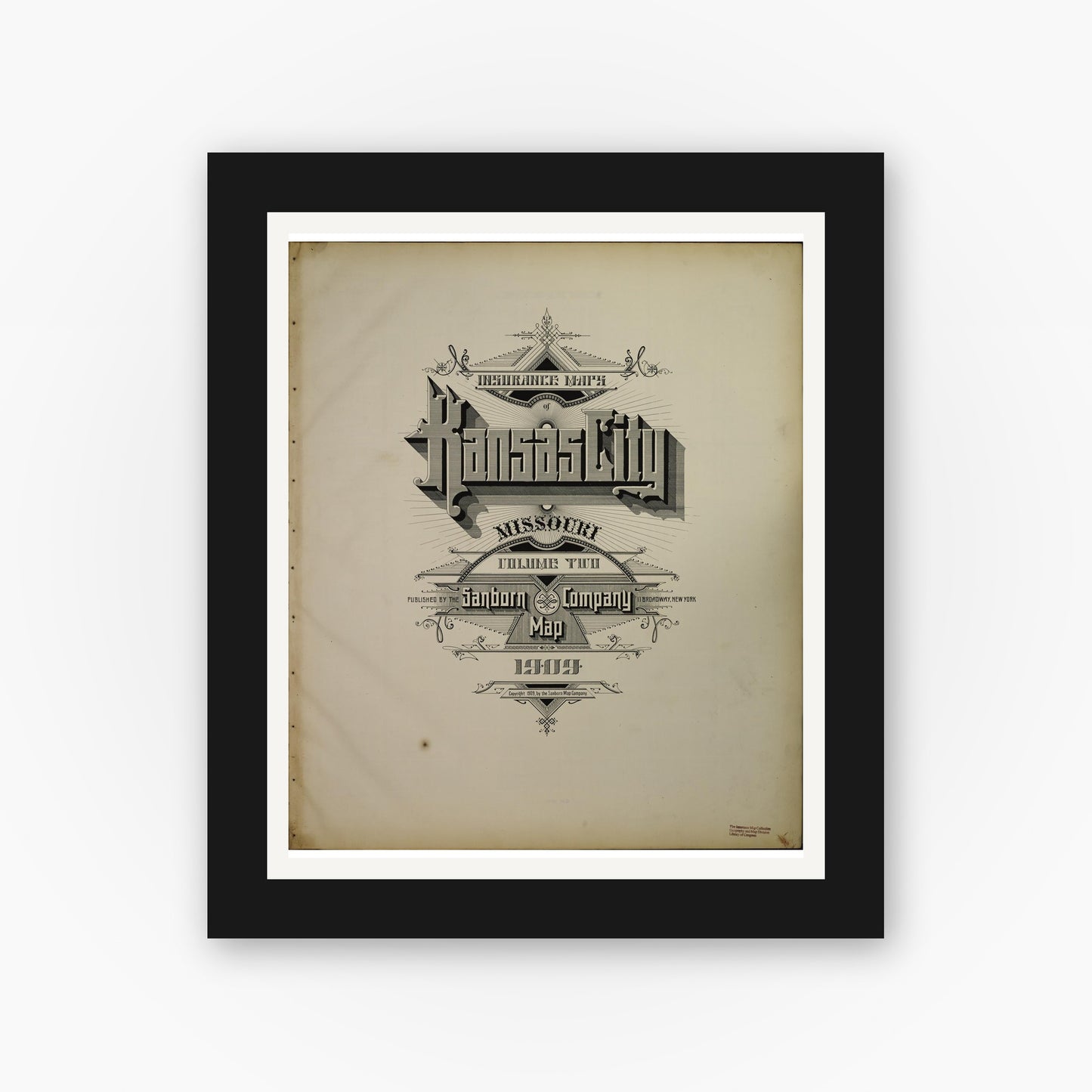 Old map wall art mockup — black gallery frame with white mat — Sanborn Fire Insurance Map from Kansas City, Jackson, Clay, And Platte Counties, Missouri (1909) - Complete Map Set