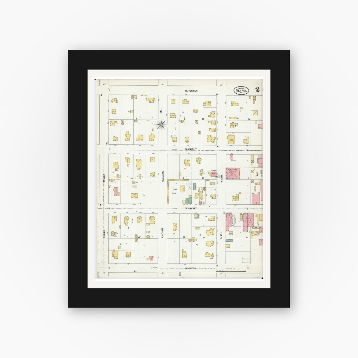Old map wall art mockup — black gallery frame with white mat — Sanborn Fire Insurance Map from Nevada, Vernon County, Missouri (1900), Sheet #0002