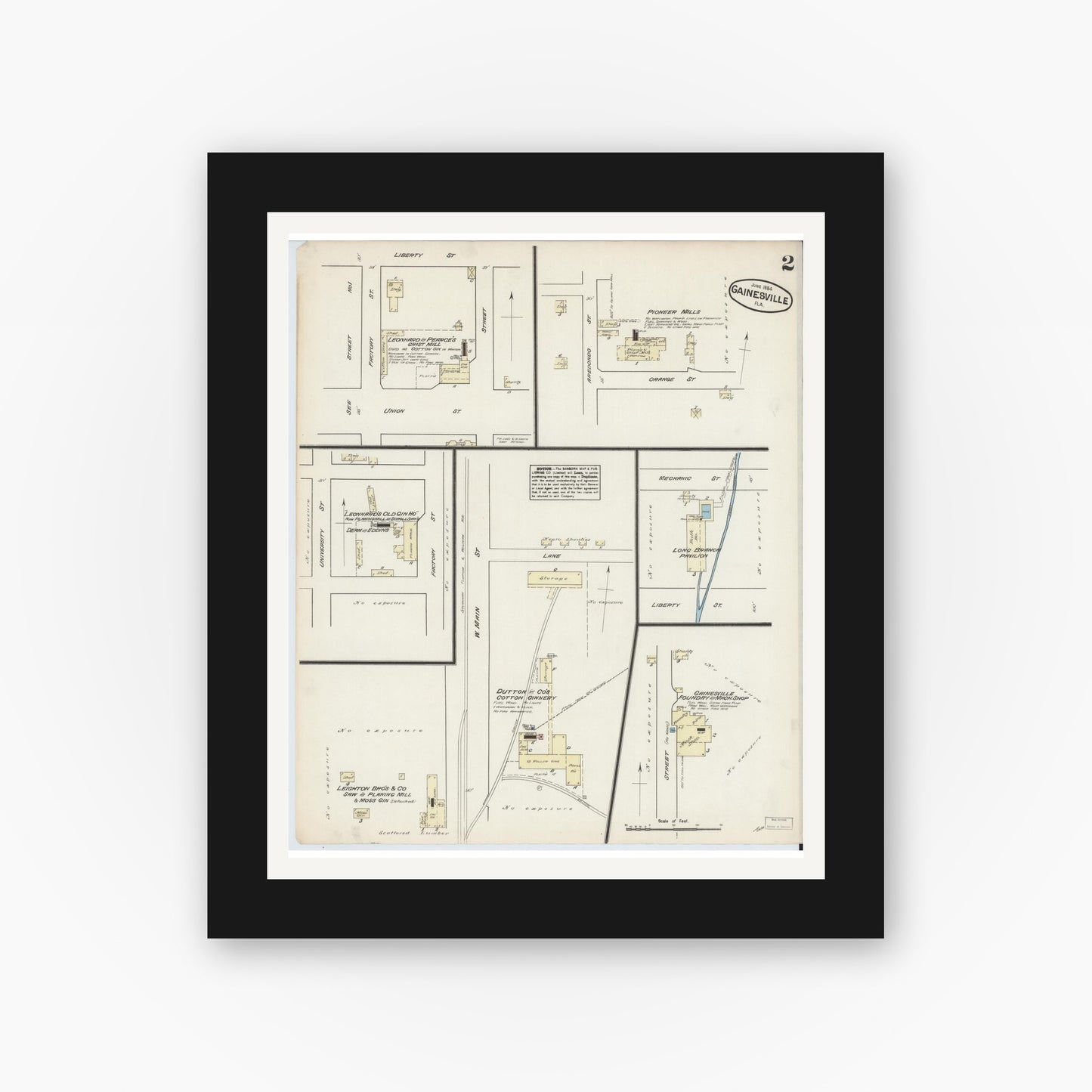 Old map wall art mockup — black gallery frame with white mat — Sanborn Fire Insurance Map from Gainesville, Alachua County, Florida (1884), Sheet #0002