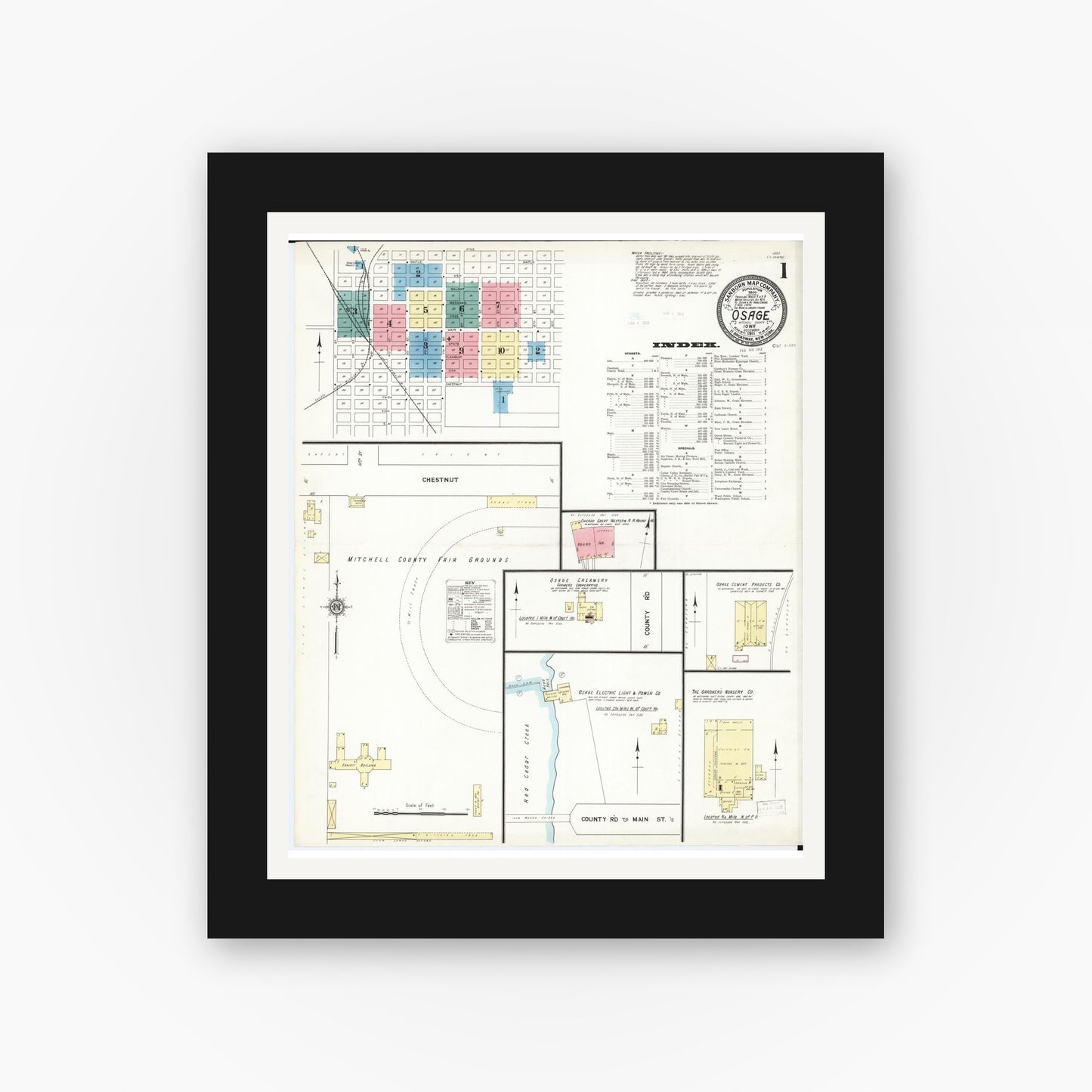 Old map wall art mockup — black gallery frame with white mat — Sanborn Fire Insurance Map from Osage, Mitchell County, Iowa (1911) — Complete Set