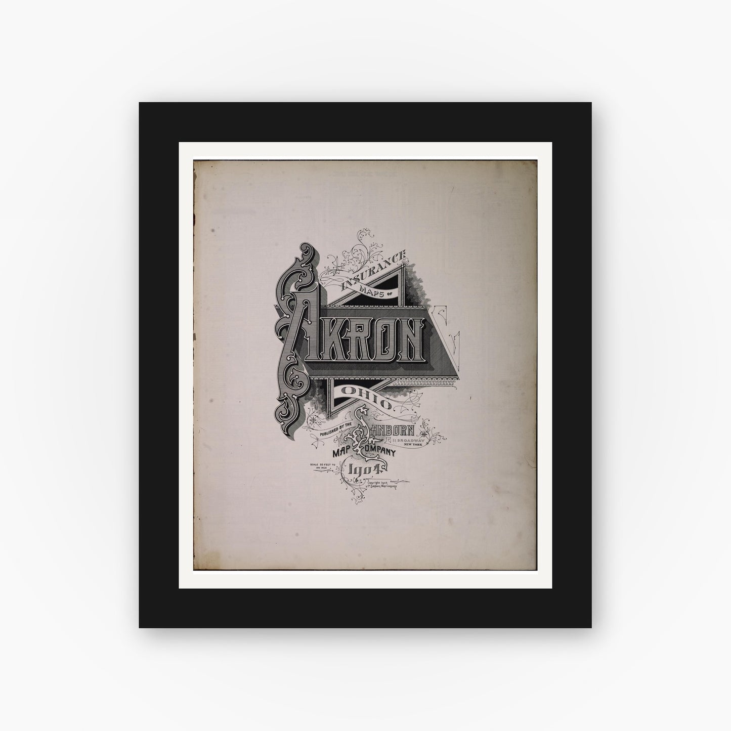 Old map wall art mockup — black gallery frame with white mat — Sanborn Fire Insurance Map from Akron, Summit County, Ohio (1904), Sheet #0001