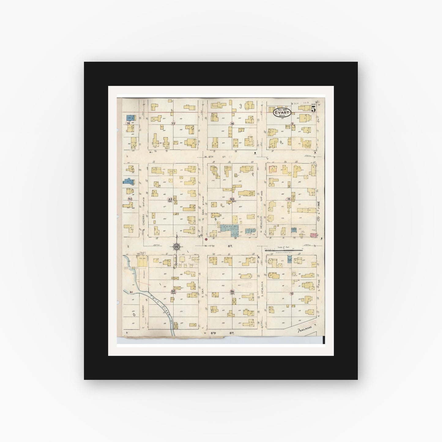 Old map wall art mockup — black gallery frame with white mat — Sanborn Fire Insurance Map from Evart, Osceola County, Michigan (1942), Sheet #0005