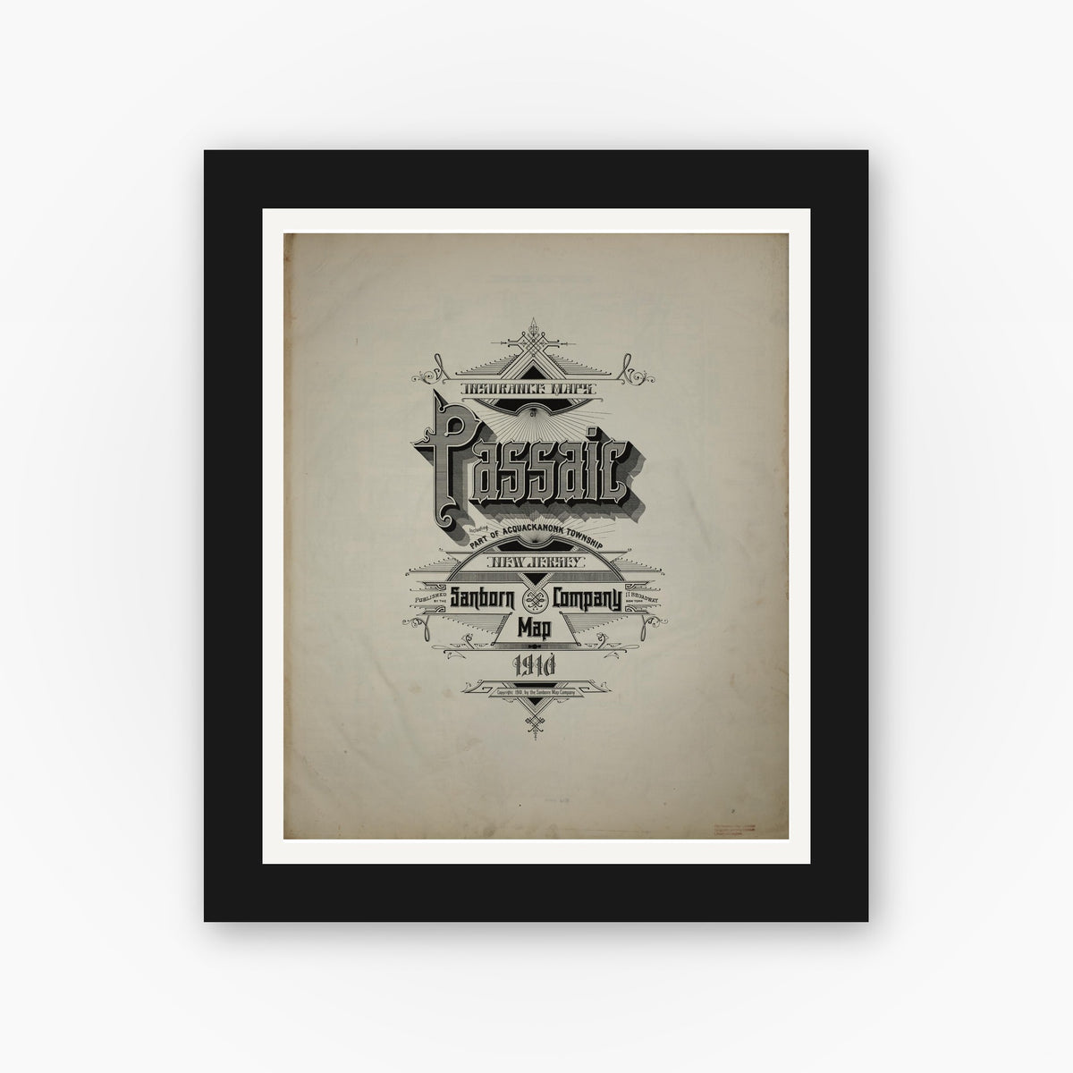 Old map wall art mockup — black gallery frame with white mat — Sanborn Fire Insurance Map from Passaic, Passaic County, New Jersey (1910), Sheet #0001