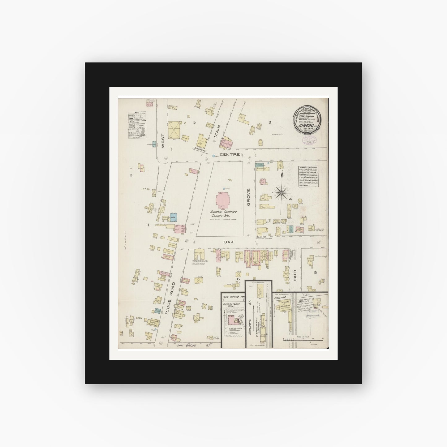 Old map wall art mockup — black gallery frame with white mat — Sanborn Fire Insurance Map from Juneau, Dodge County, Wisconsin (1884), Sheet #0001