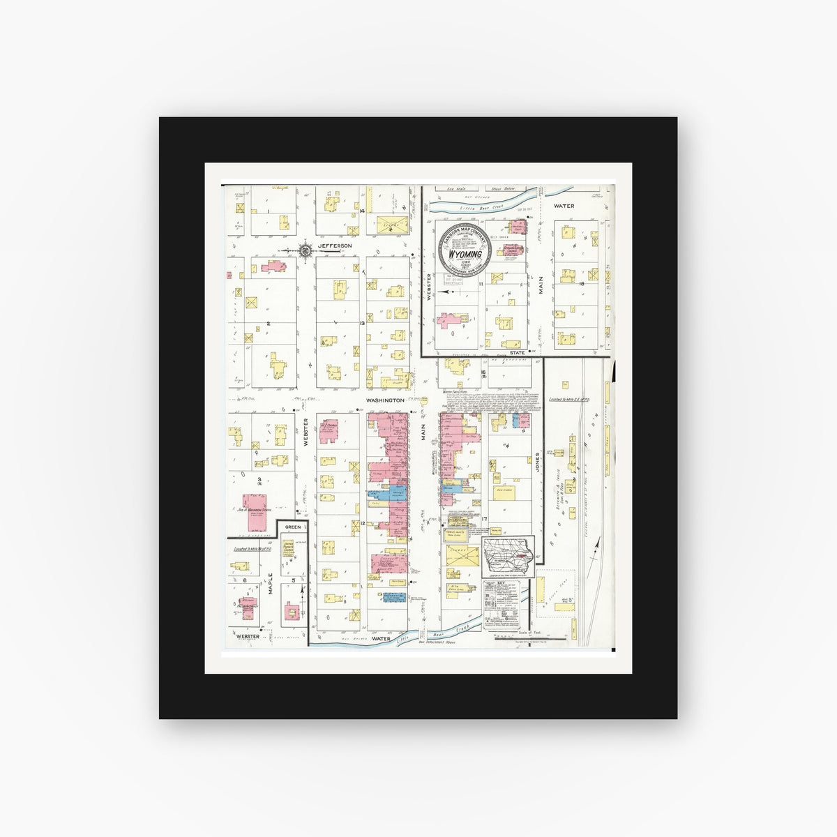 Old map wall art mockup — black gallery frame with white mat — Sanborn Fire Insurance Map from Wyoming, Jones County, Iowa (1917), Sheet #0001